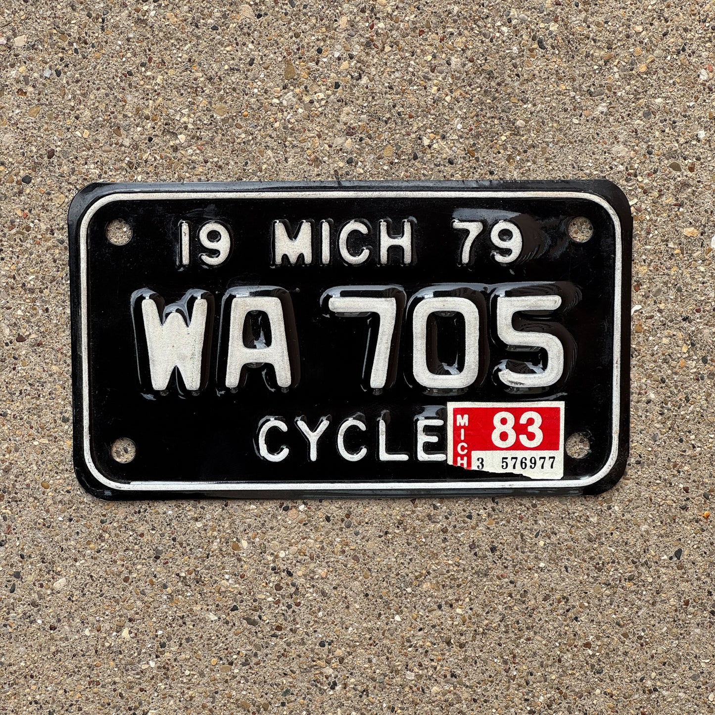 Photo of a 1979 1983 Michigan Motorcycle License Plate Auto Tag Garage Decor Vintage WA 705 with original patina