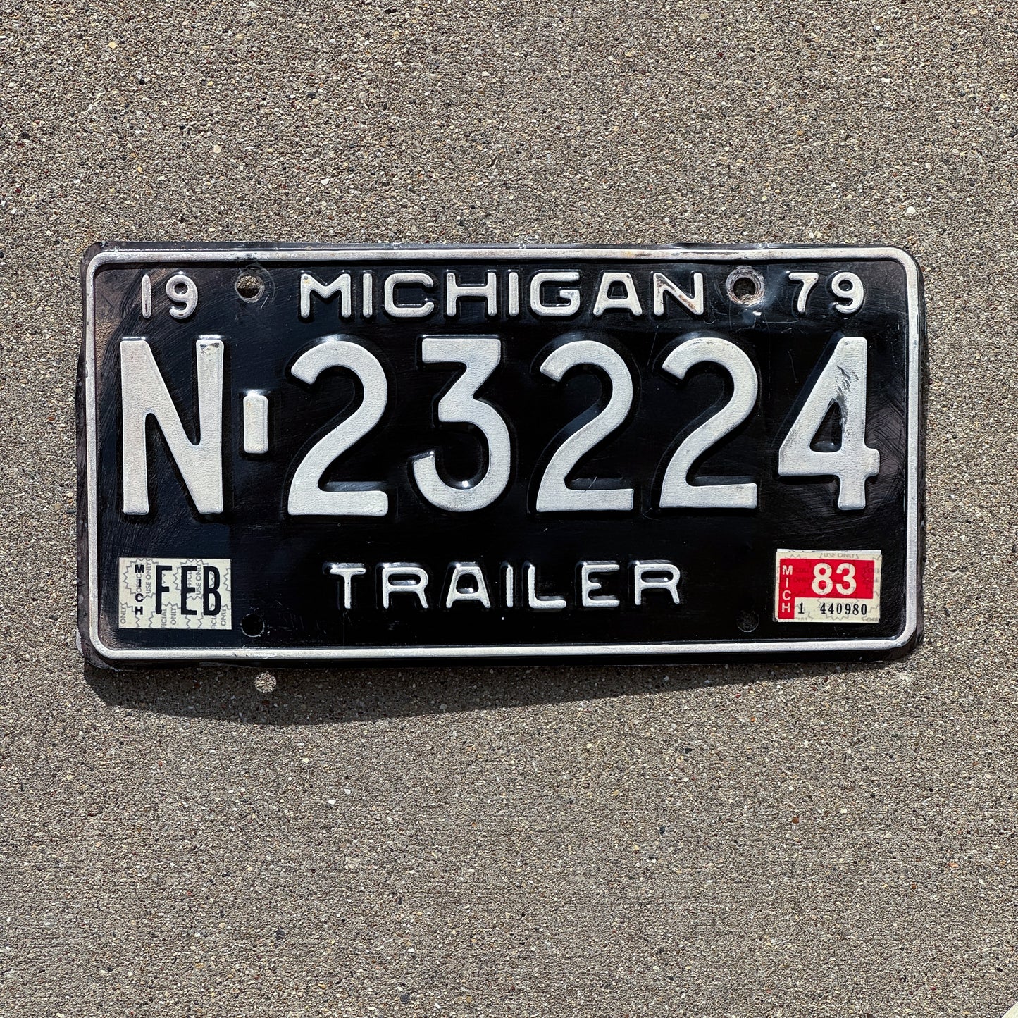 Photo of a 1979 1983 Michigan Trailer License Plate Auto Tag Garage Decor Vintage N 23224 with original patina