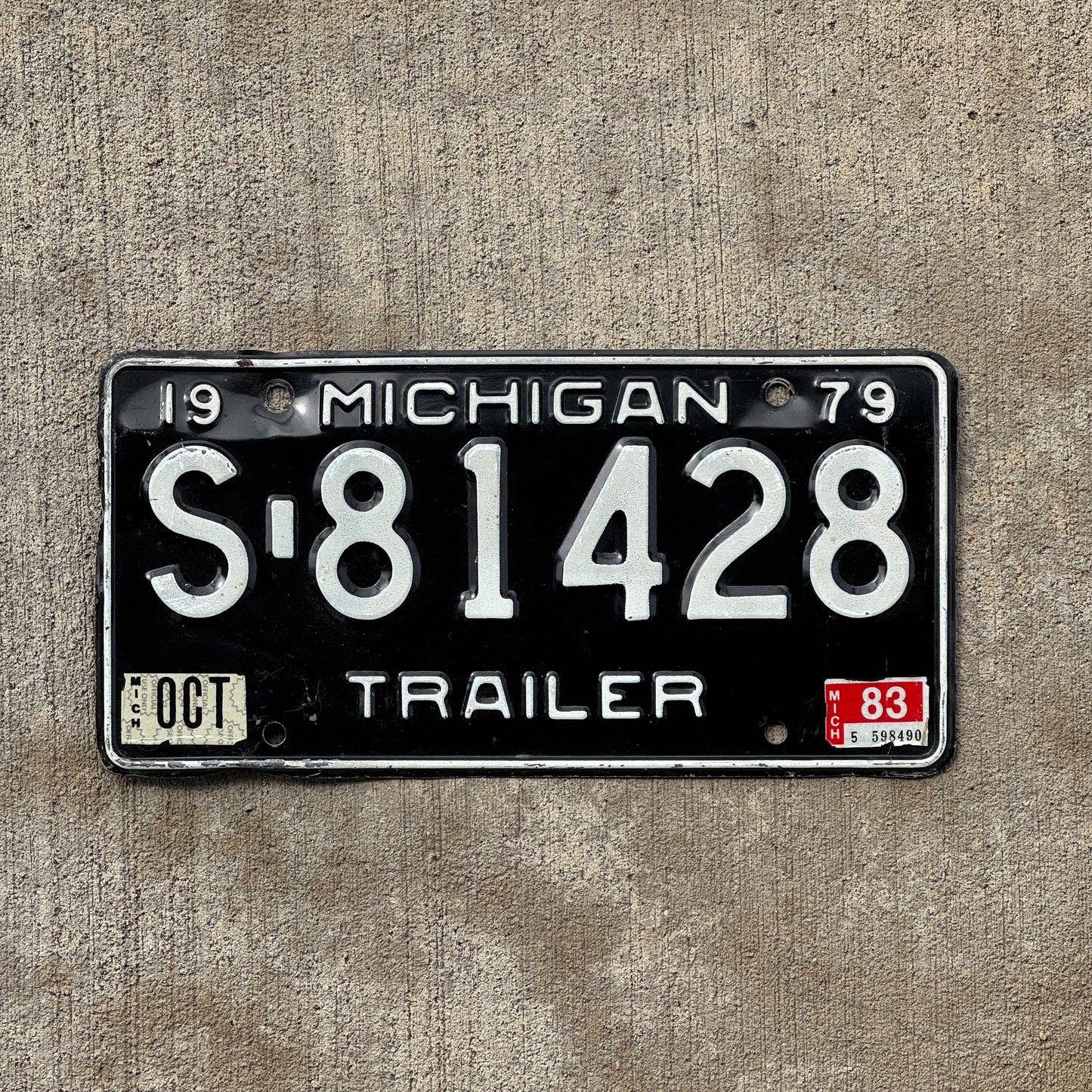 Photo of a 1979 1983 Michigan Trailer License Plate Auto Tag Garage Decor Vintage S 81428 with original patina