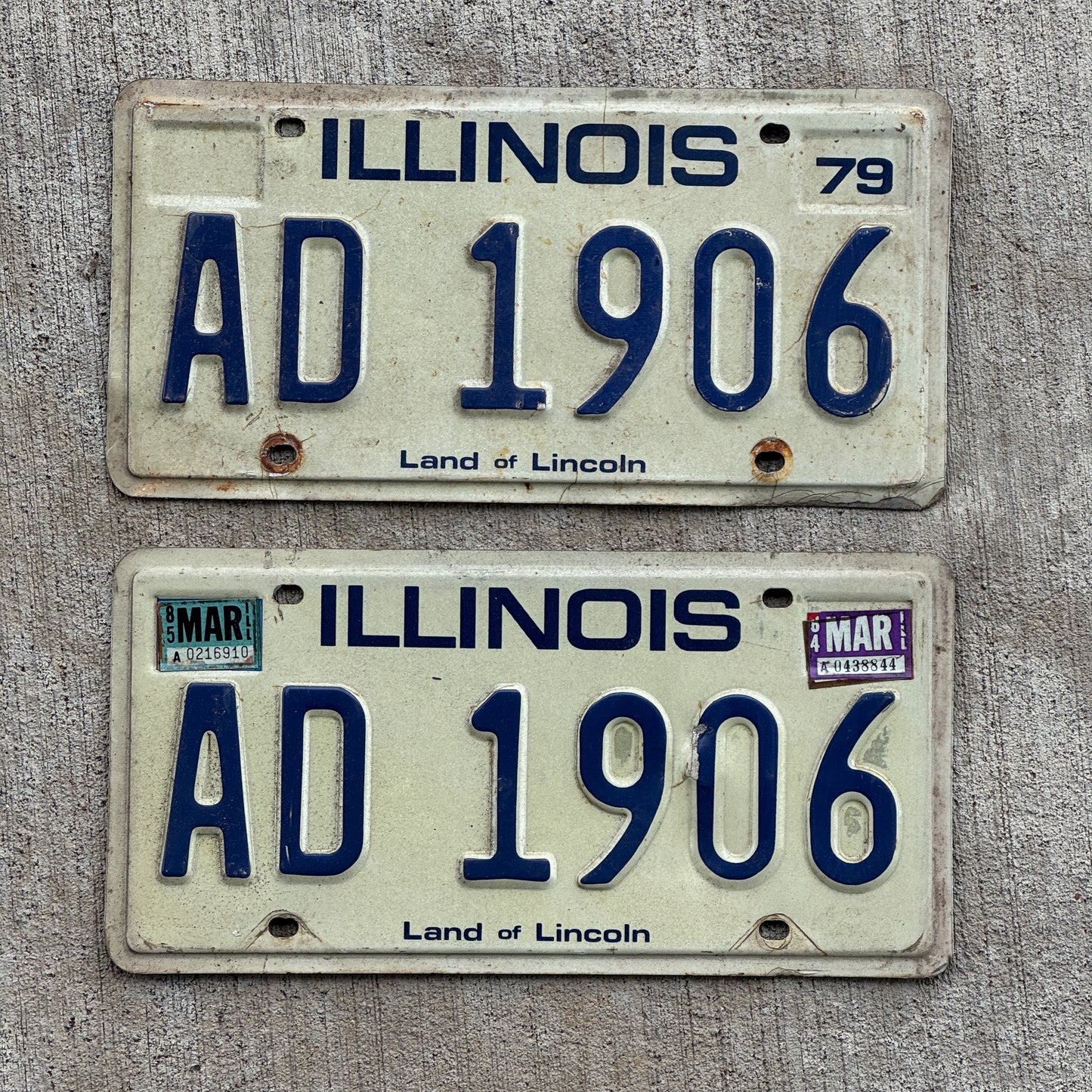 Photo of a 1979 1985 Illinois License Plate Pair Auto Tag Garage Decor Vintage AD 1906 with original patina