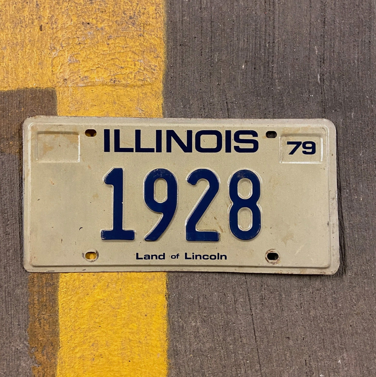 Photo of a 1979 Illinois License Plate Auto Tag Garage Decor Vintage Low Number Four Digit 1928 with original patina