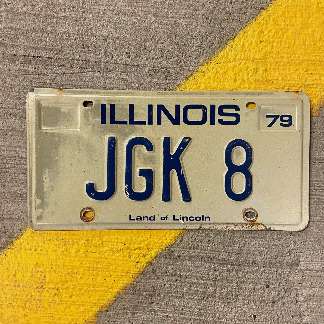 Photo of a 1979 Illinois Vanity License Plate Auto Tag Garage Decor Vintage JGK 8 with original patina