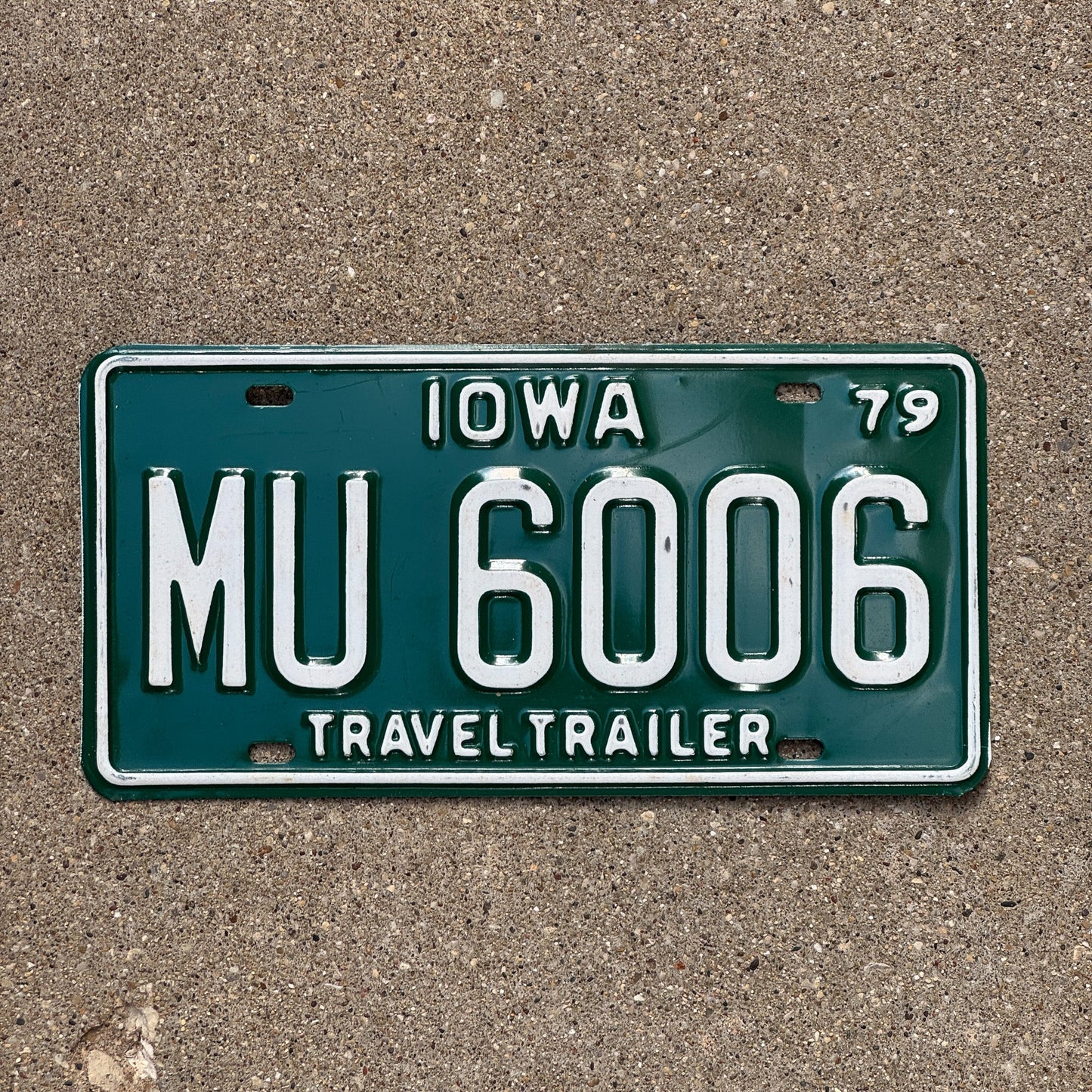 Photo of a 1979 Iowa Travel Trailer License Plate Auto Tag Garage Decor Vintage MU 6006