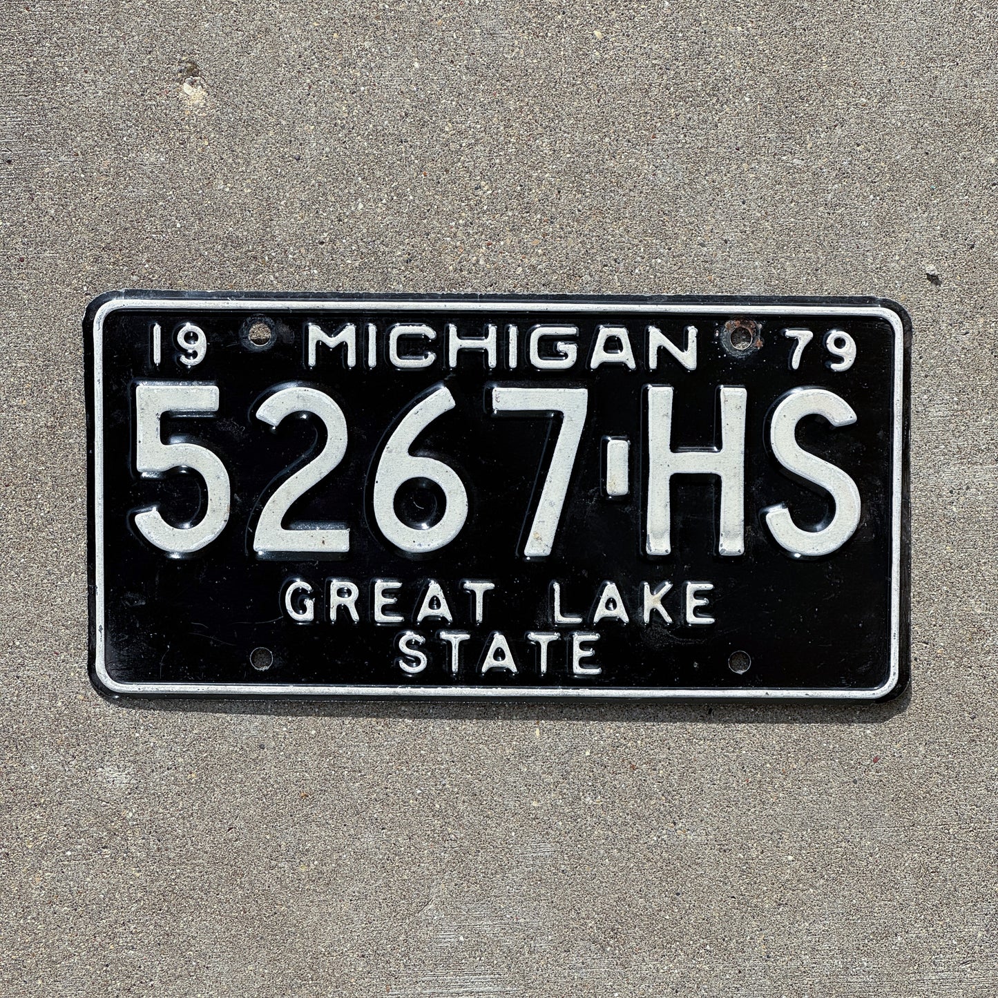 Photo of a 1979 Michigan Commercial License Plate Auto Tag Garage Decor Vintage 5267 HS with original patina