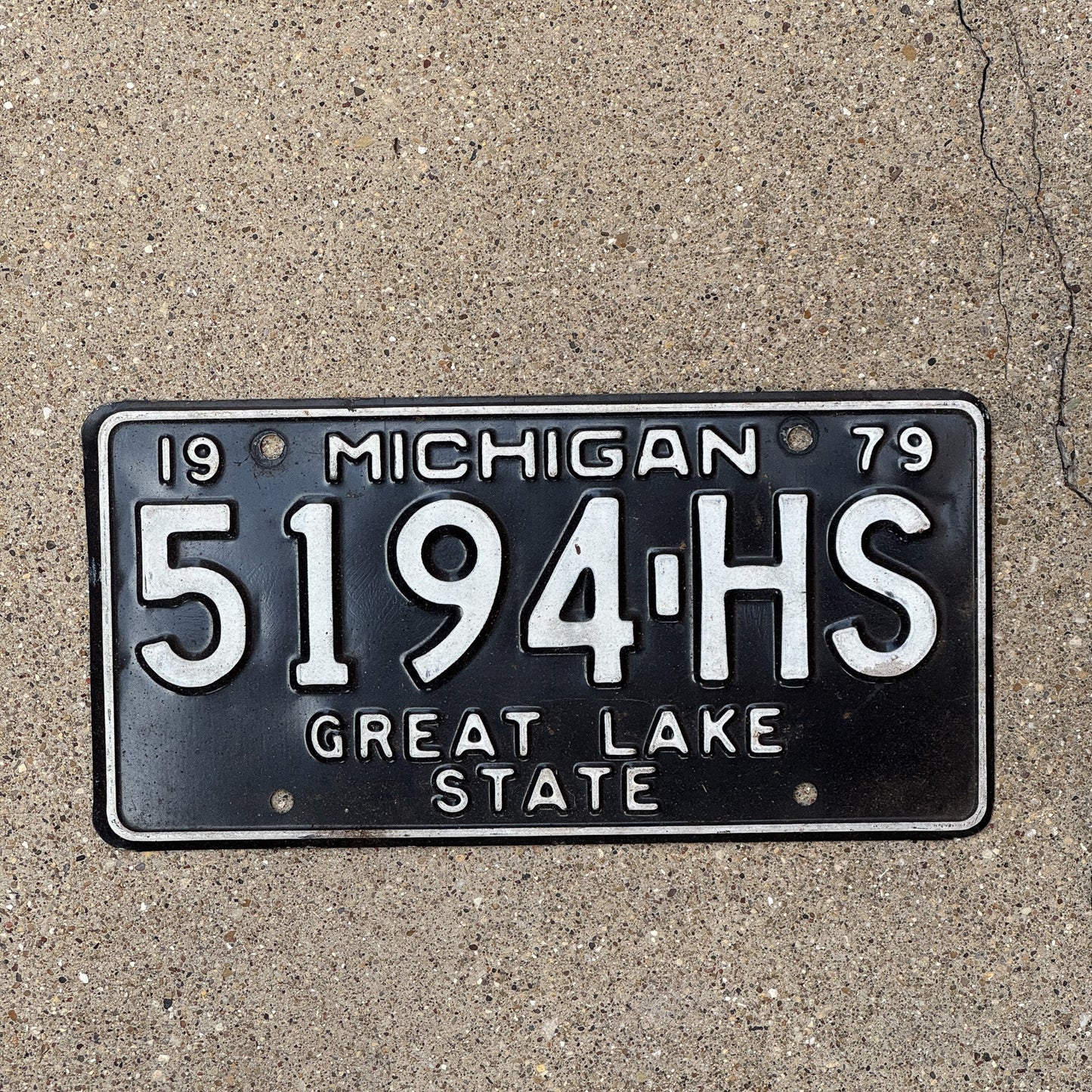 Photo of a 1979 Michigan Commercial Truck License Plate Auto Tag Garage Decor Vintage 5194 HS