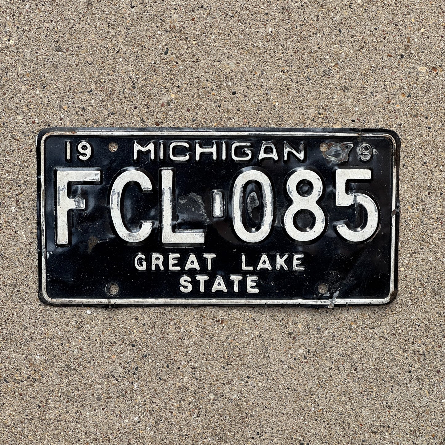Photo of a 1979 Michigan License Plate Auto Tag Garage Decor Vintage FCL 085 with original patina
