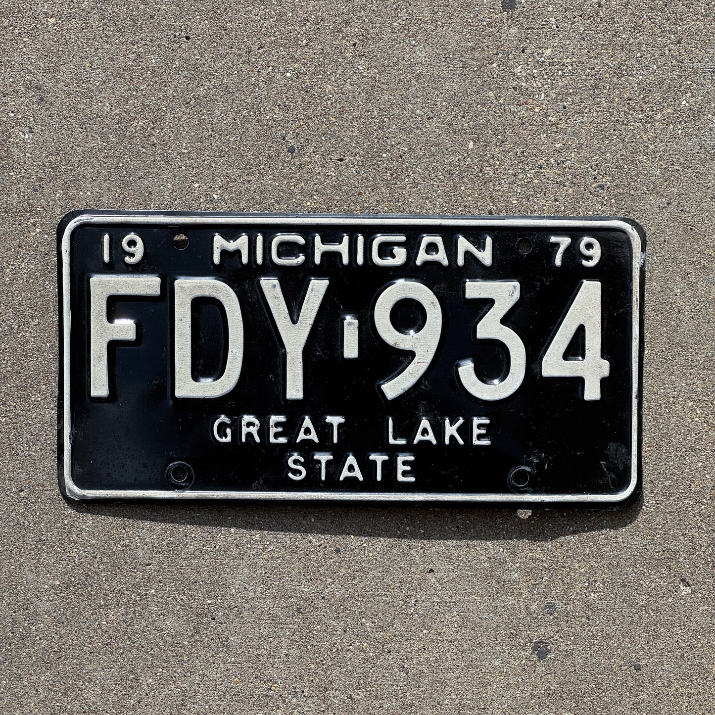 Photo of a 1979 Michigan License Plate Auto Tag Garage Decor Vintage FDY 934 with original patina