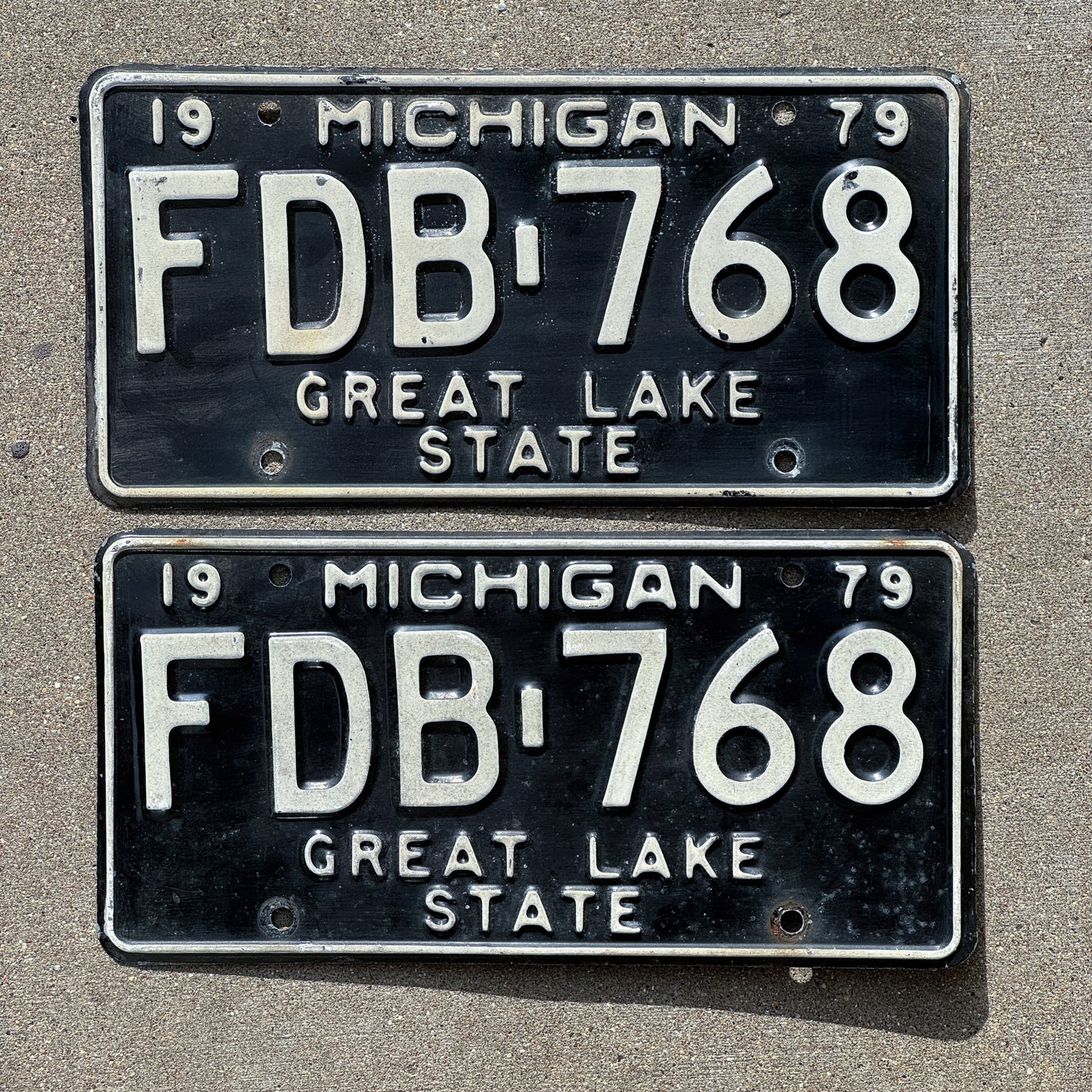 Photo of a 1979 Michigan License Plate Pair Auto Tag Garage Decor Vintage FDB 768 with original patina