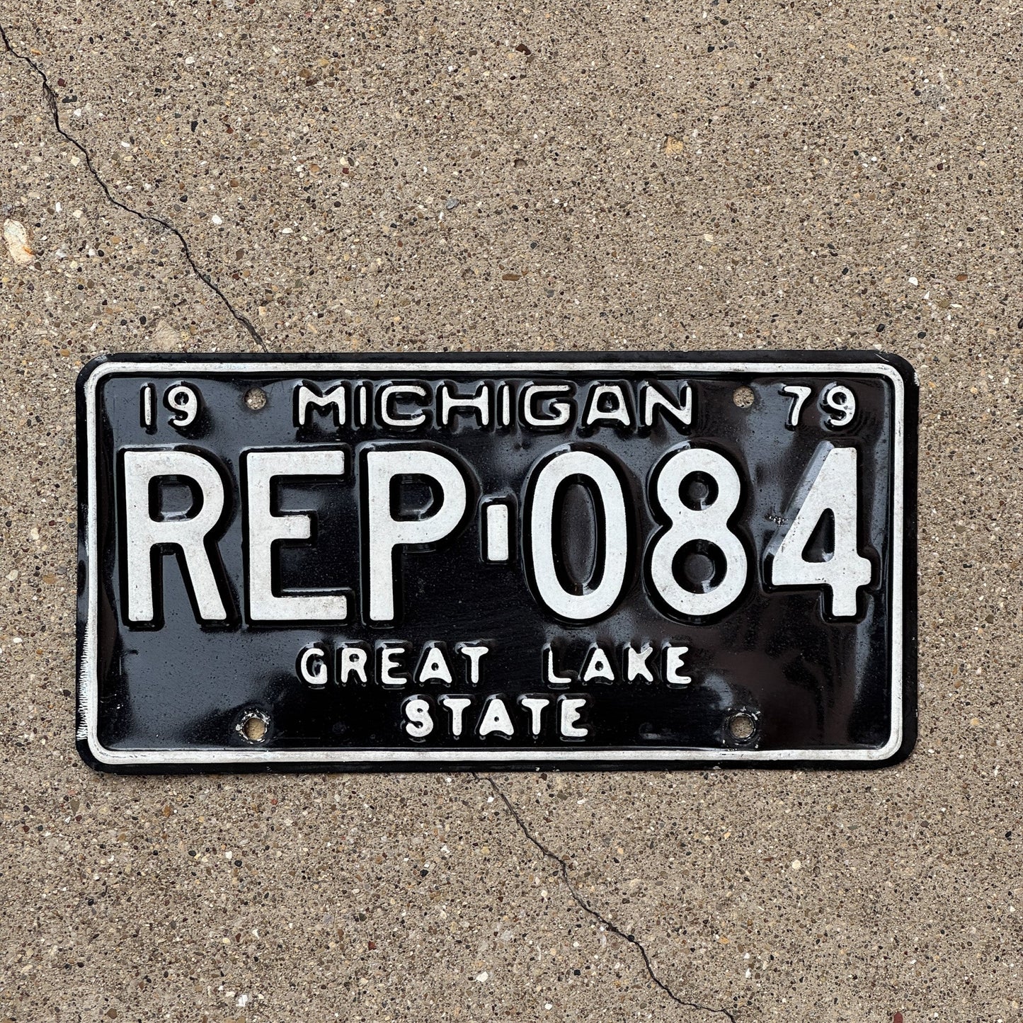 Photo of a 1979 Michigan State Representative License Plate Auto Tag Garage Decor Vintage Politician Loren Armbruster REP 084