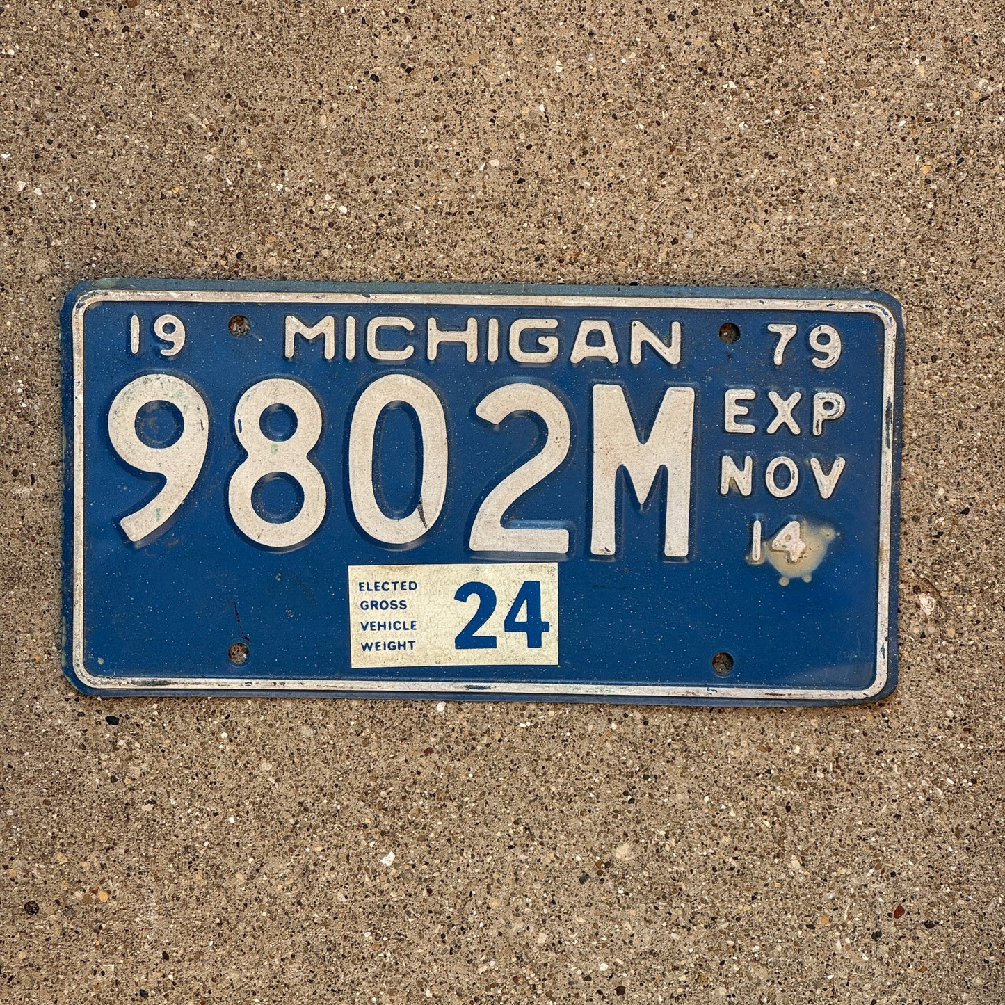 Photo of a 1979 Michigan Truck Half Year License Plate Auto Tag Garage Decor Vintage November 9802 M