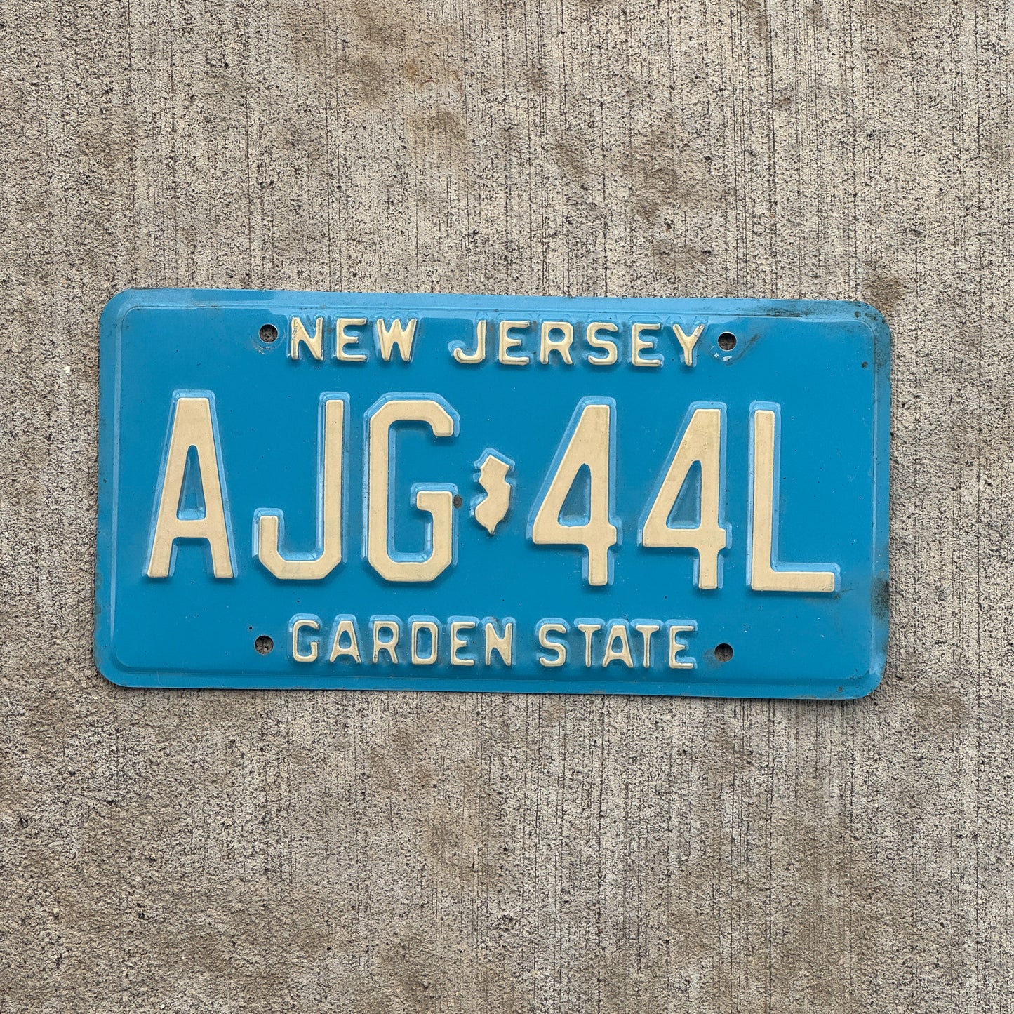Photo of a 1979 New Jersey License Plate Auto Tag 2 Vintage Garage Blue AJG 44L with original patina