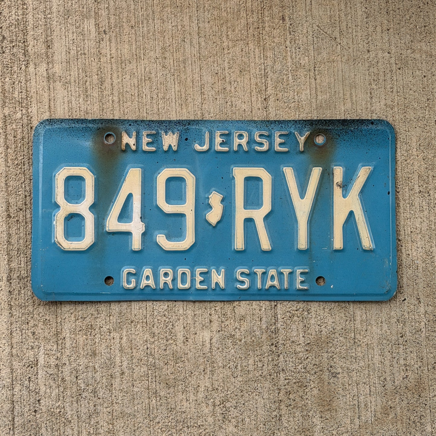Photo of a 1979 New Jersey License Plate Auto Tag Garage Decor Vintage Blue 849 RYK with original patina