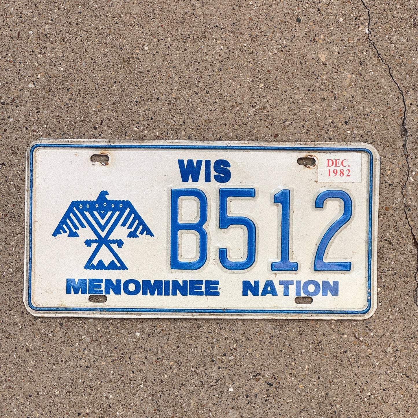 Photo of a 1980 1982 Wisconsin Menominee Nation License Plate Auto Tag Garage Decor Vintage Native American Indian Tribe B 512 with original patina