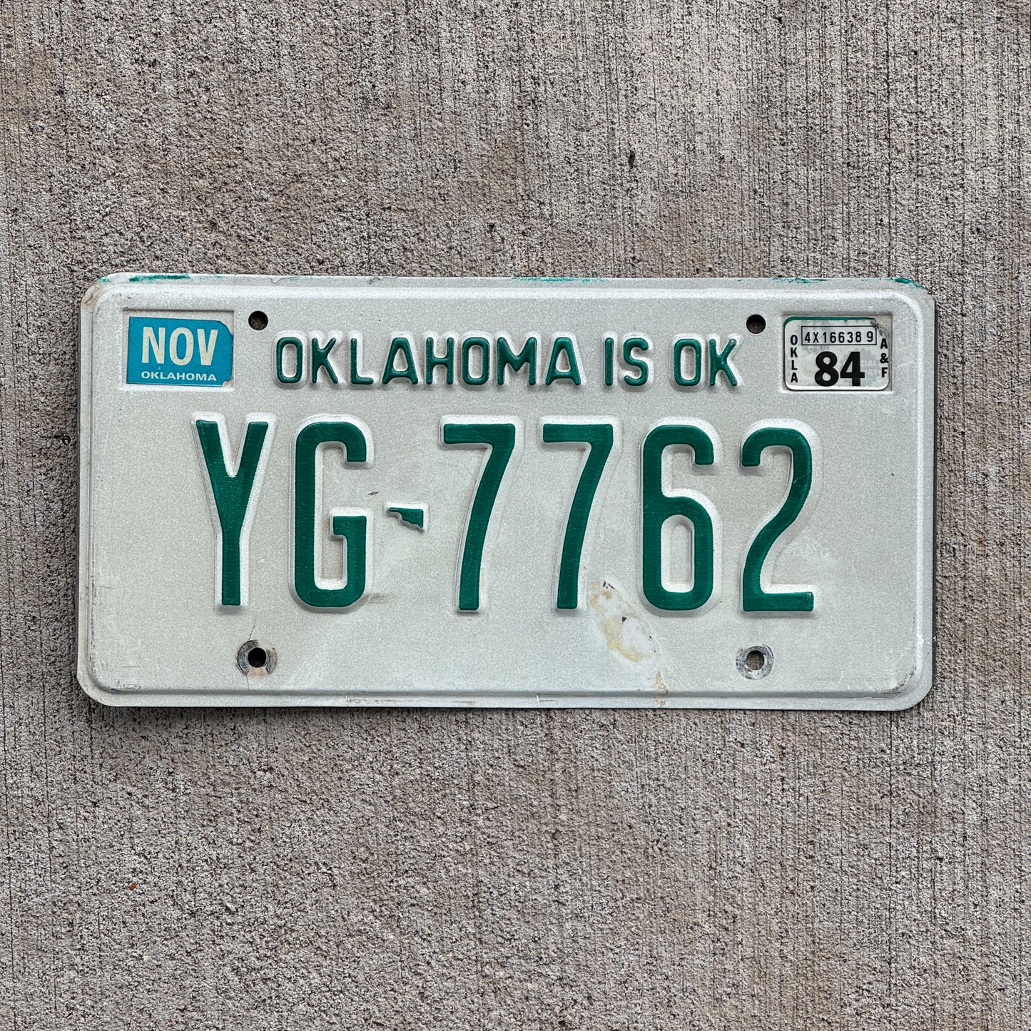 Photo of a 1980 1984 Oklahoma License Plate Auto Tag Garage Decor Vintage YG 7762 with original patina