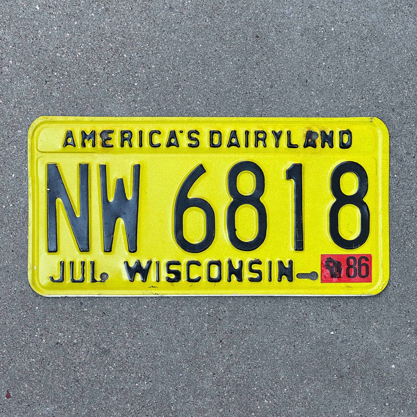 Photo of a 1980 1986 Wisconsin License Plate Auto Tag Garage Decor Vintage NW 6818 with original patina