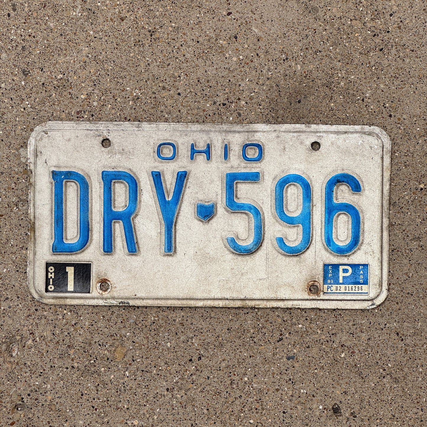 Photo of a 1980 1991 Ohio License Plate Auto Tag 1 Vintage Garage DRY 596 with original patina