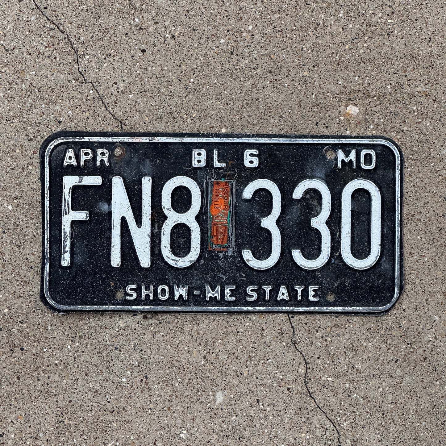 Photo of a 1980 1997 Missouri Truck License Plate Auto Tag Garage Decor Vintage FN 8330