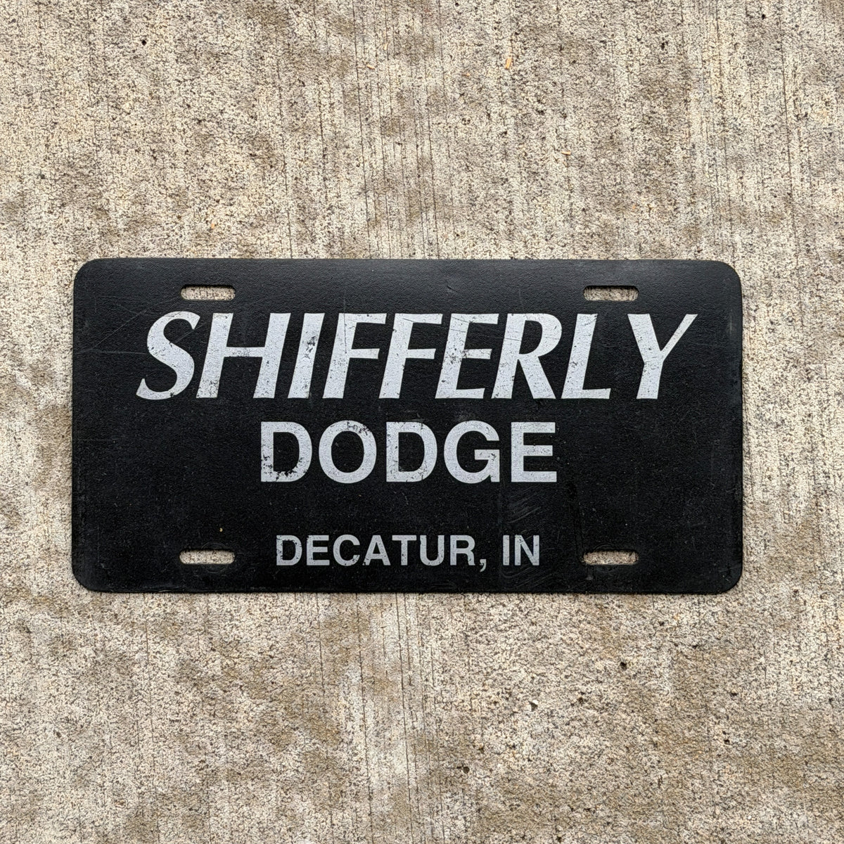 Photo of a 1980 Era Decatur Indiana Booster License Plate Auto Tag Garage Decor Vintage Shifferly Dodge Plastic with original patina