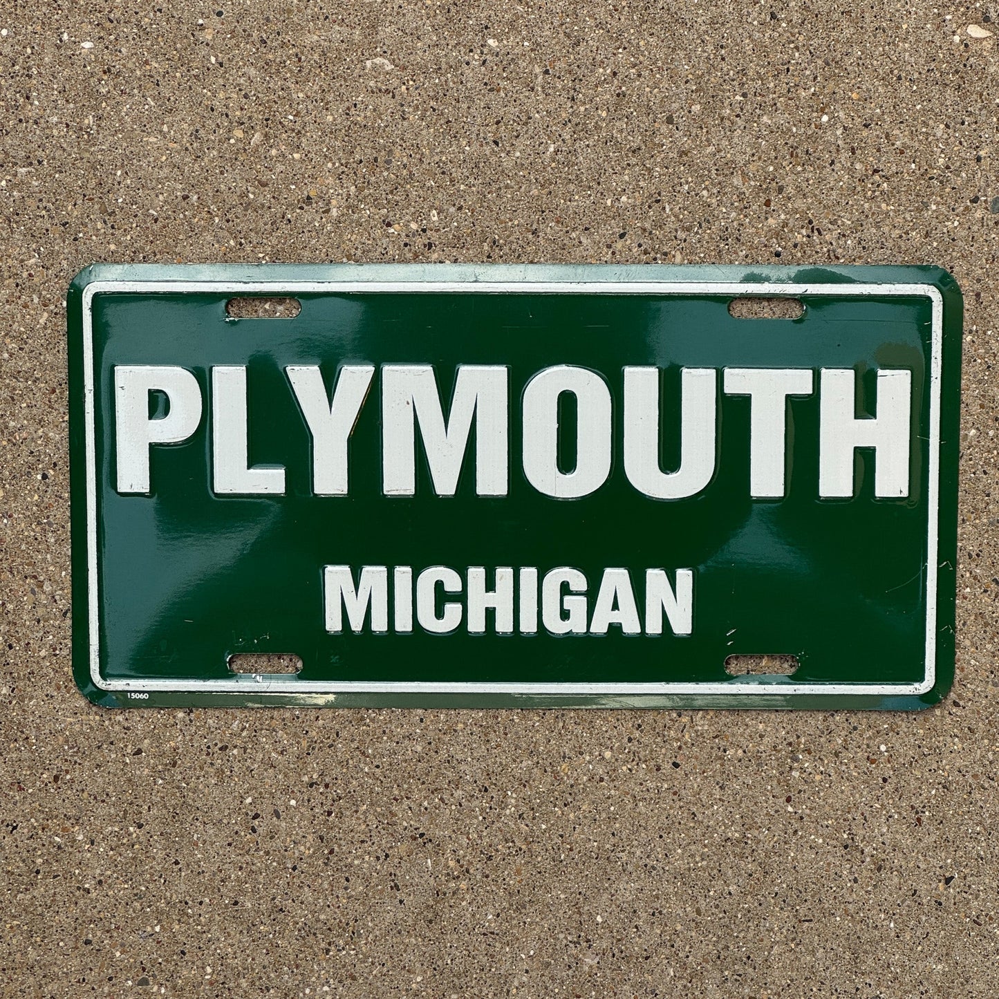 Photo of a 1980 Era Michigan Booster License Plate Auto Tag Garage Decor Vintage Plymouth