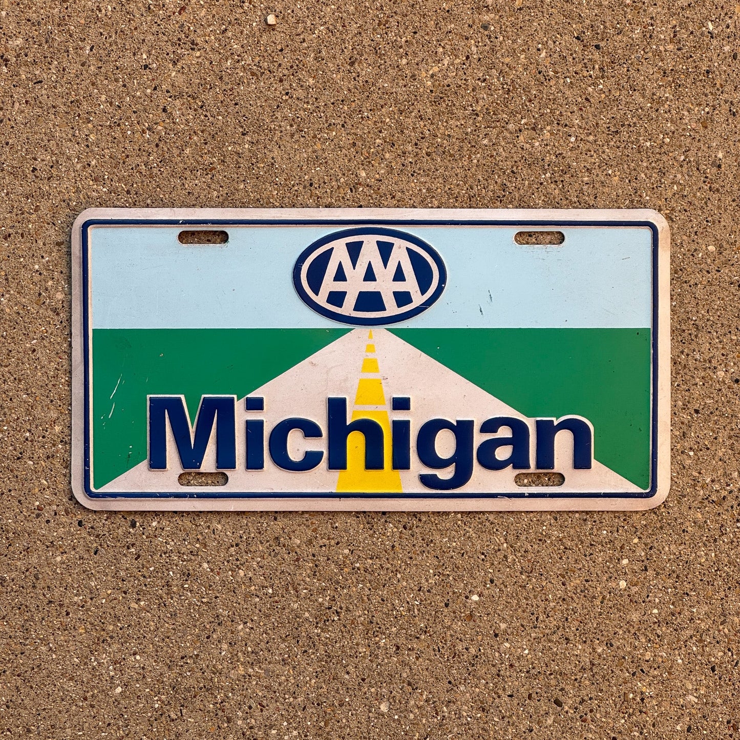 Photo of a 1980 Era Michigan Booster License Plate Auto Tag Garage Decor Vintage Road Driving AAA