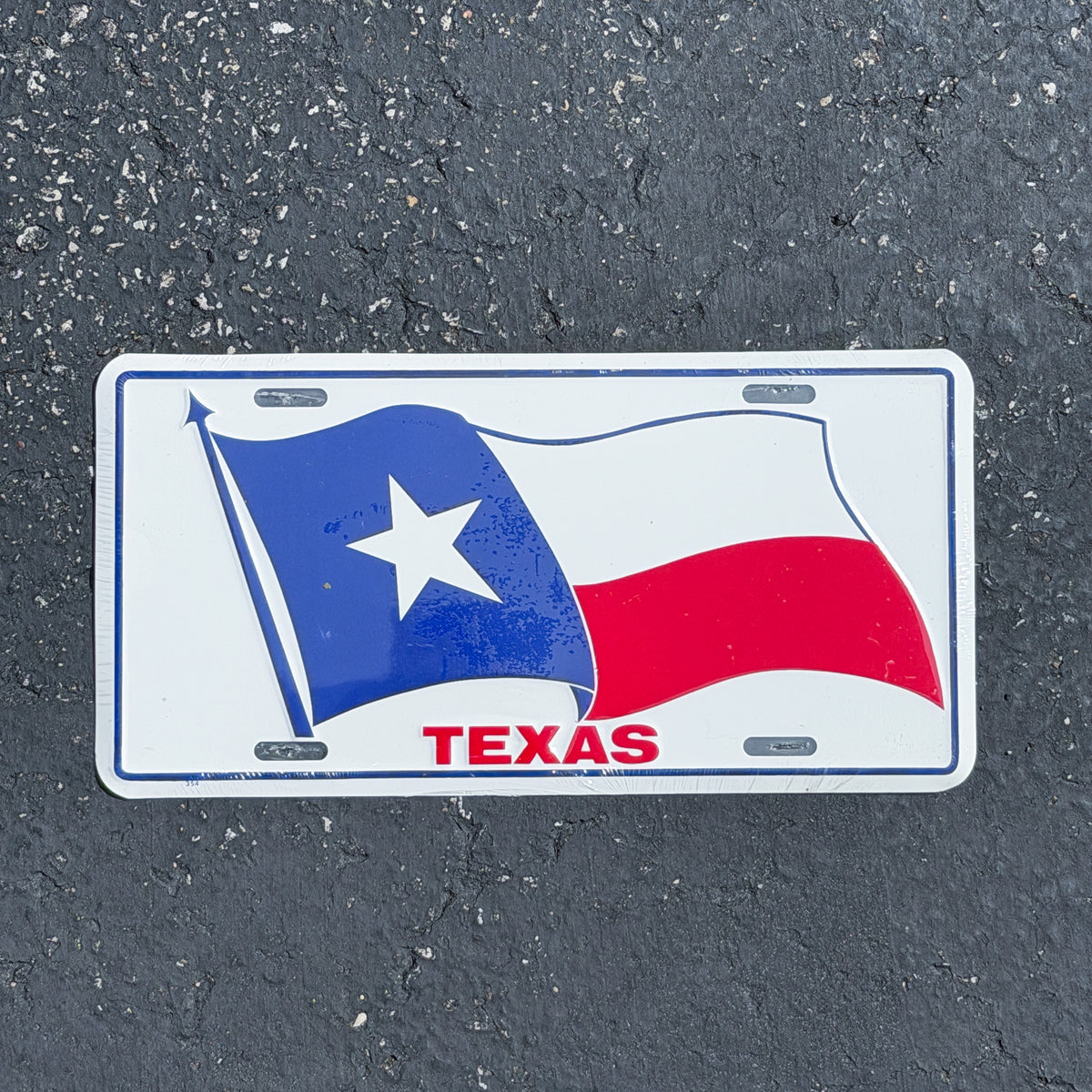 Photo of a 1980 Era Texas Booster License Plate Auto Tag Garage Decor Vintage
State Flag Metal NOS with original patina