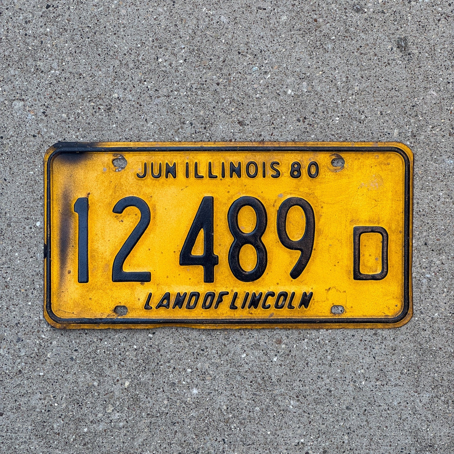 Photo of a 1980 Illinois Truck License Plate Auto Tag Garage Decor Vintage 12 489 D with original patina
