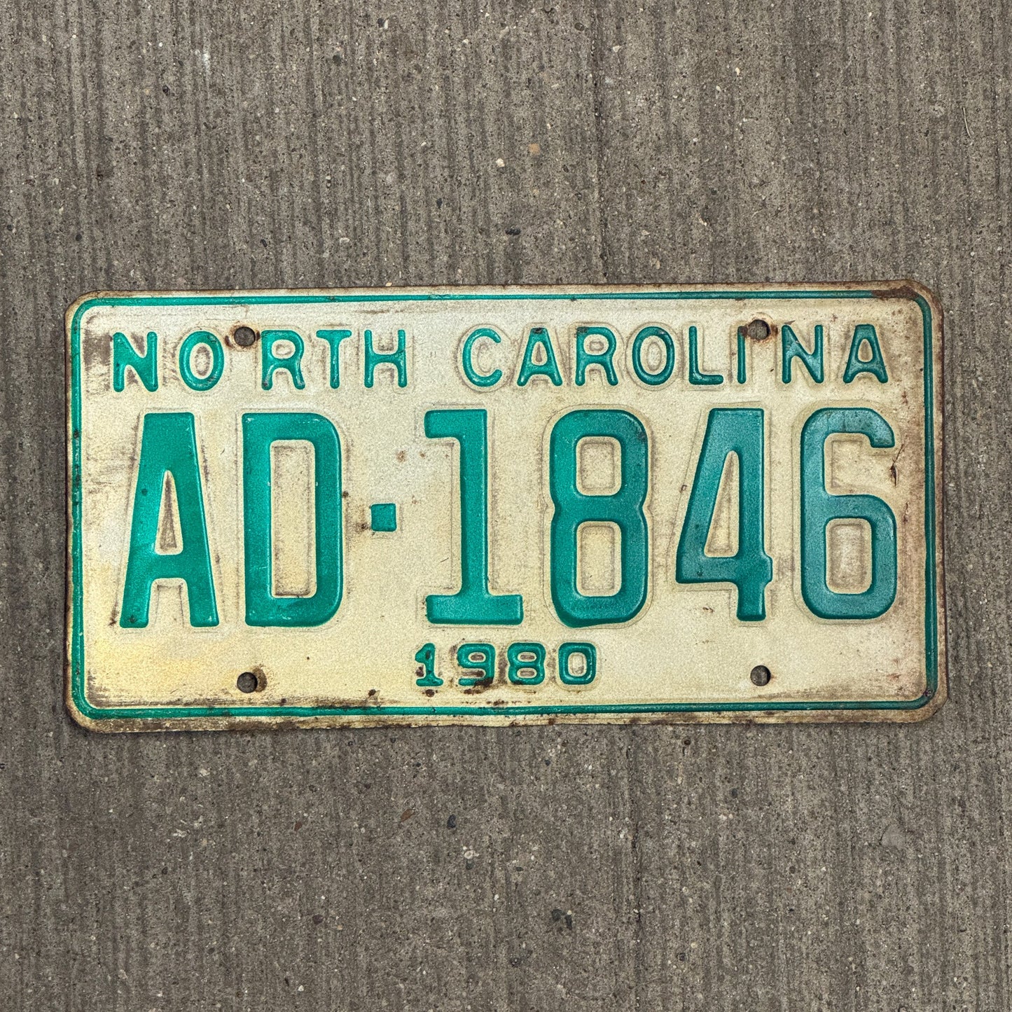 Photo of a 1980 North Carolina Commercial License Plate Auto Tag Garage Decor Vintage Truck AD 1846 with original patina