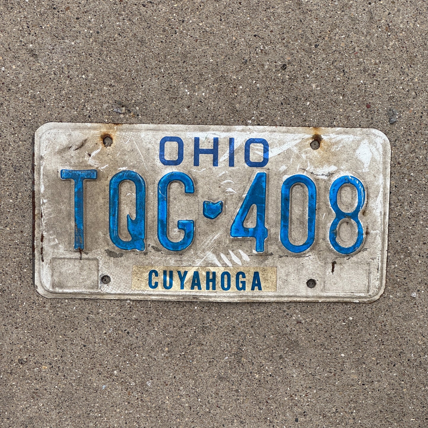 Photo of a 1980 Ohio License Plate Auto Tag 1 Vintage Garage TQG 408 with original patina