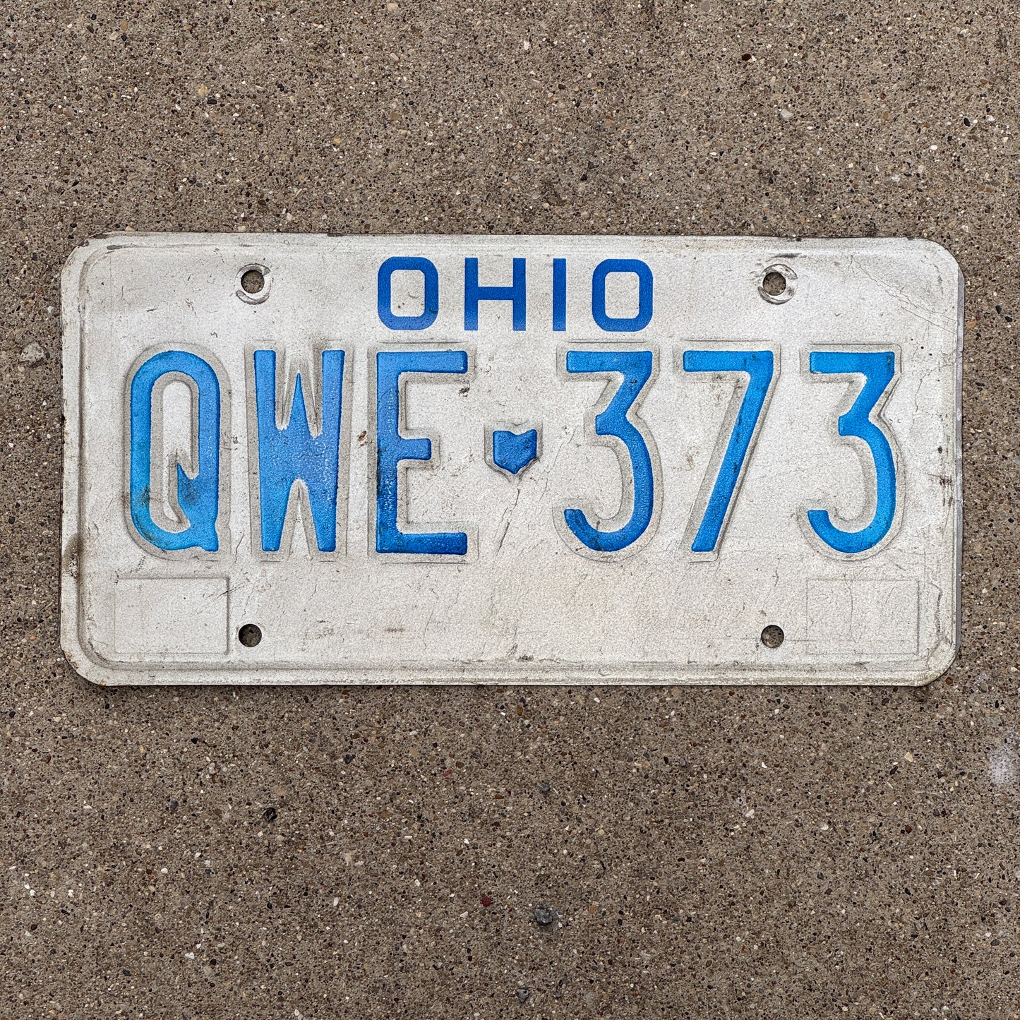 Photo of a 1980 Ohio License Plate Auto Tag 2 Vintage Garage QWE 373 with original patina