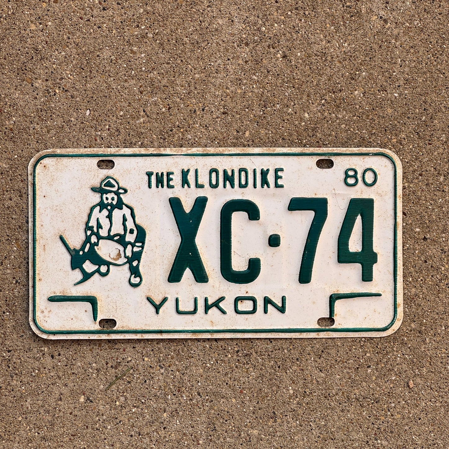 Photo of a 1980 Yukon License Plate Auto Tag Garage Decor Vintage Klondike Gold Miner XC 74