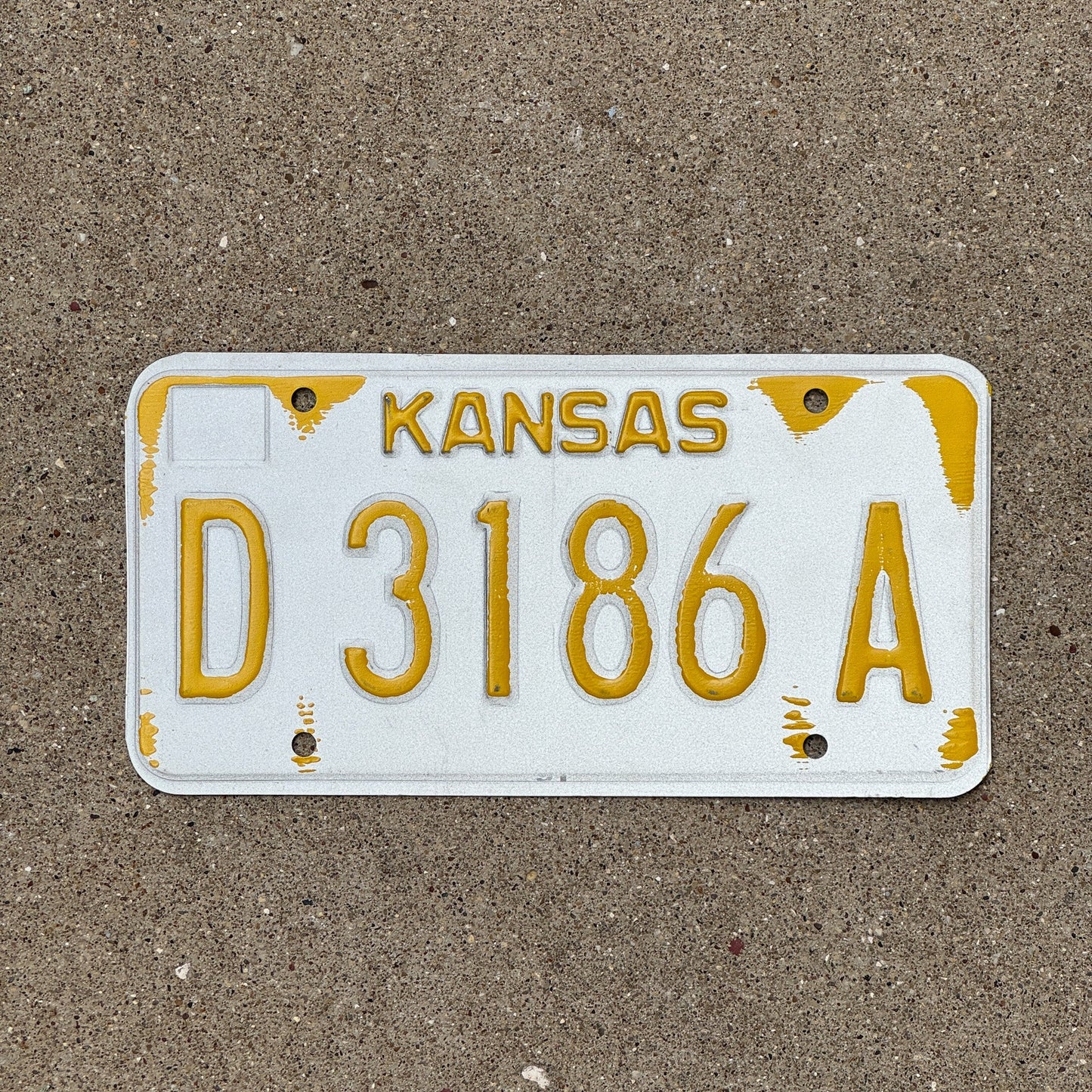Photo of a 1980s 1990s Kansas Dealer Error License Plate Auto Tag Garage Decor Vintage Misprint D 3186 A