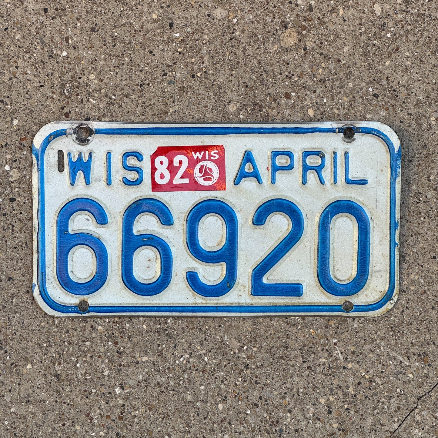 Photo of a 1981 1982 Wisconsin Motorcycle License Plate Auto Tag Garage Decor Vintage 66920 with original patina