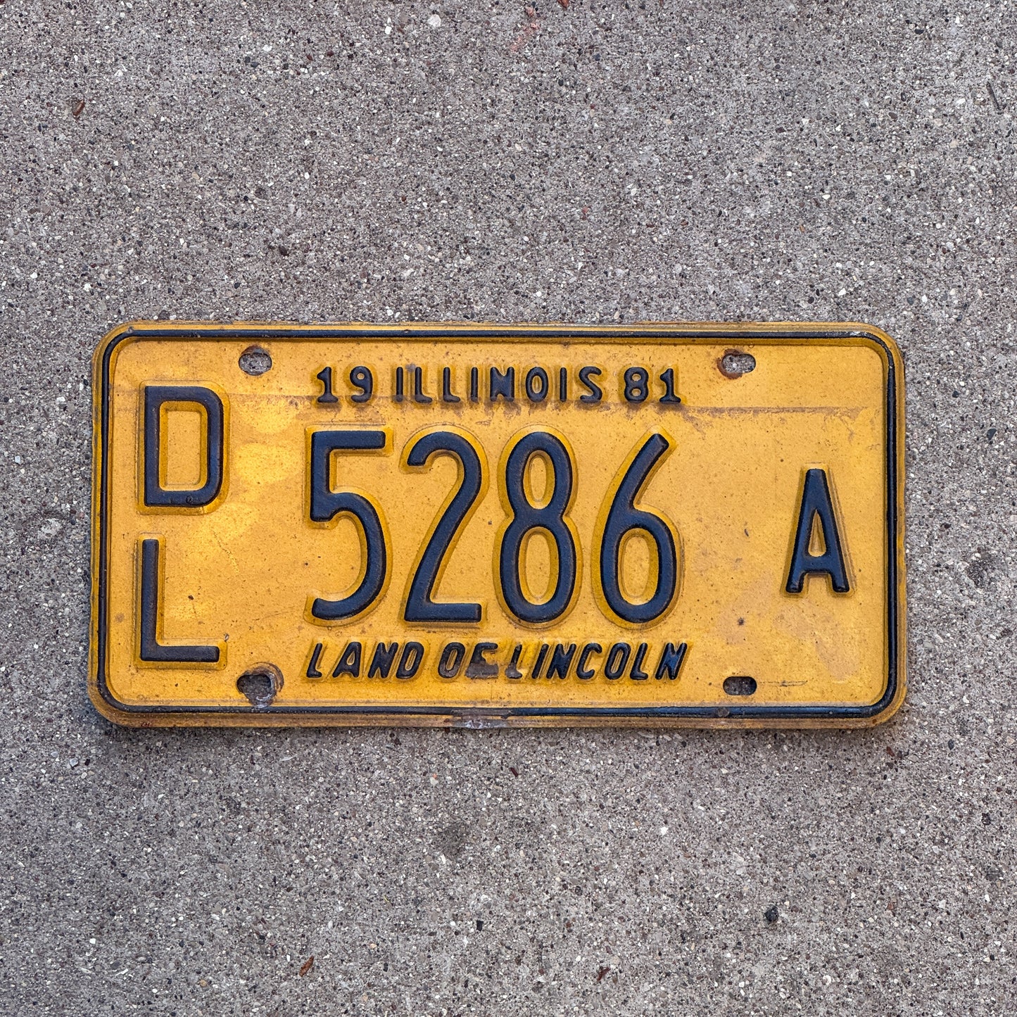 Photo of a 1981 Illinois Dealer License Plate Auto Tag Garage Decor Vintage 5286 A with original patina