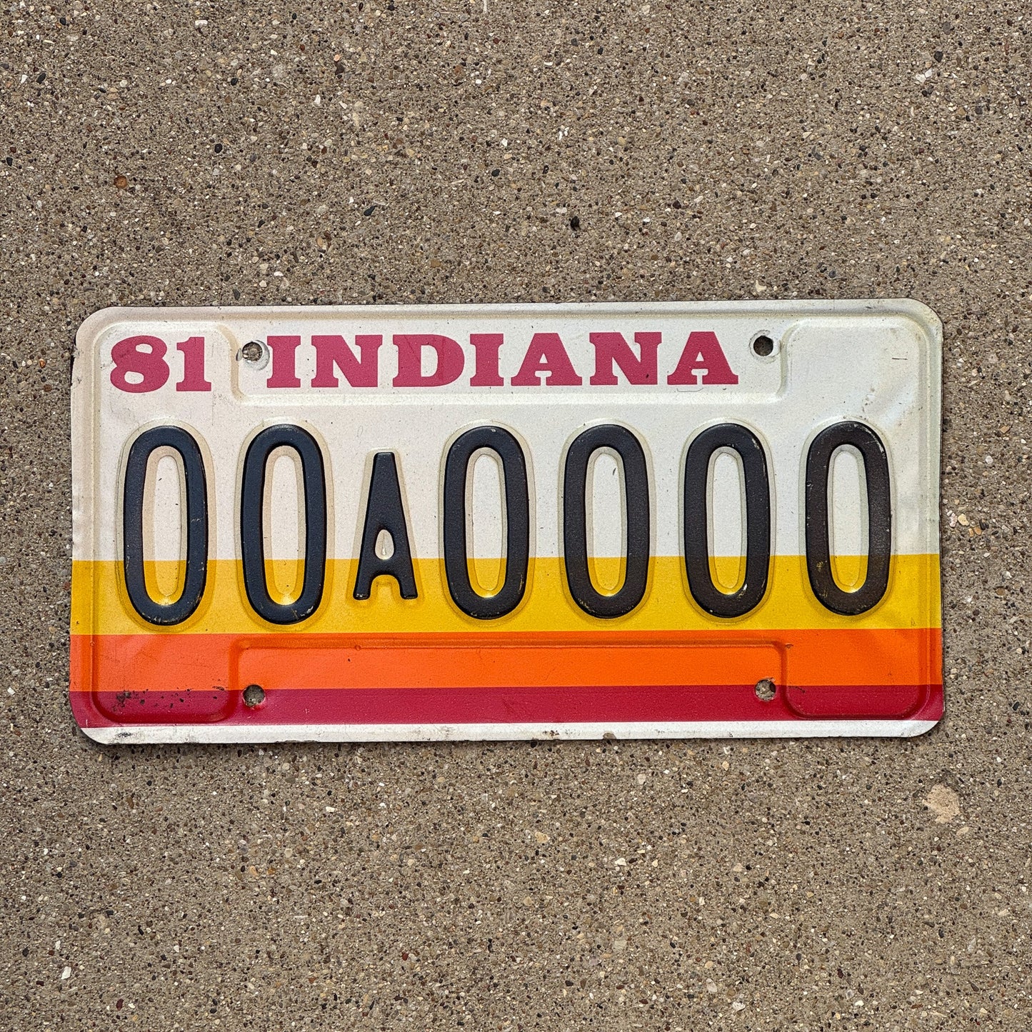 Photo of a 1981 Indiana Sample License Plate Auto Tag 1 Garage Decor 00A0000 with original patina