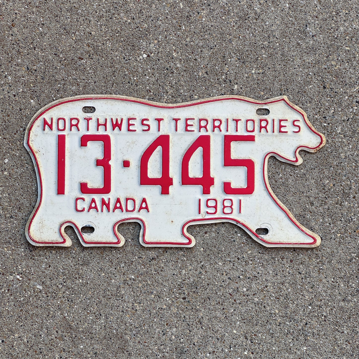 Photo of a 1981 Northwest Territories License Plate Auto Tag Garage Decor Vintage Polar Bear 13 445 with original patina