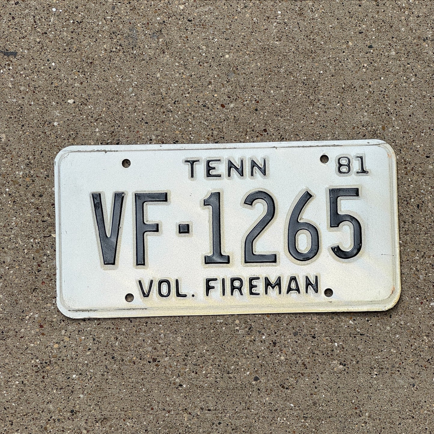Photo of a 1981 Tennessee Volunteer Fireman License Plate Auto Tag Garage Decor Vintage VF 1265