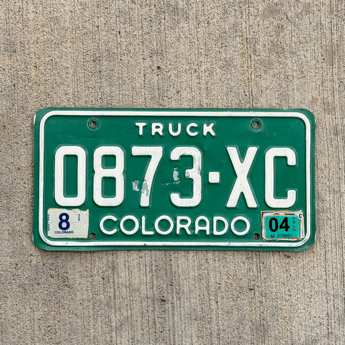 Photo of a 1982 2004 Colorado Truck License Plate Auto Tag Garage Decor Vintage 0873 XC with original patina