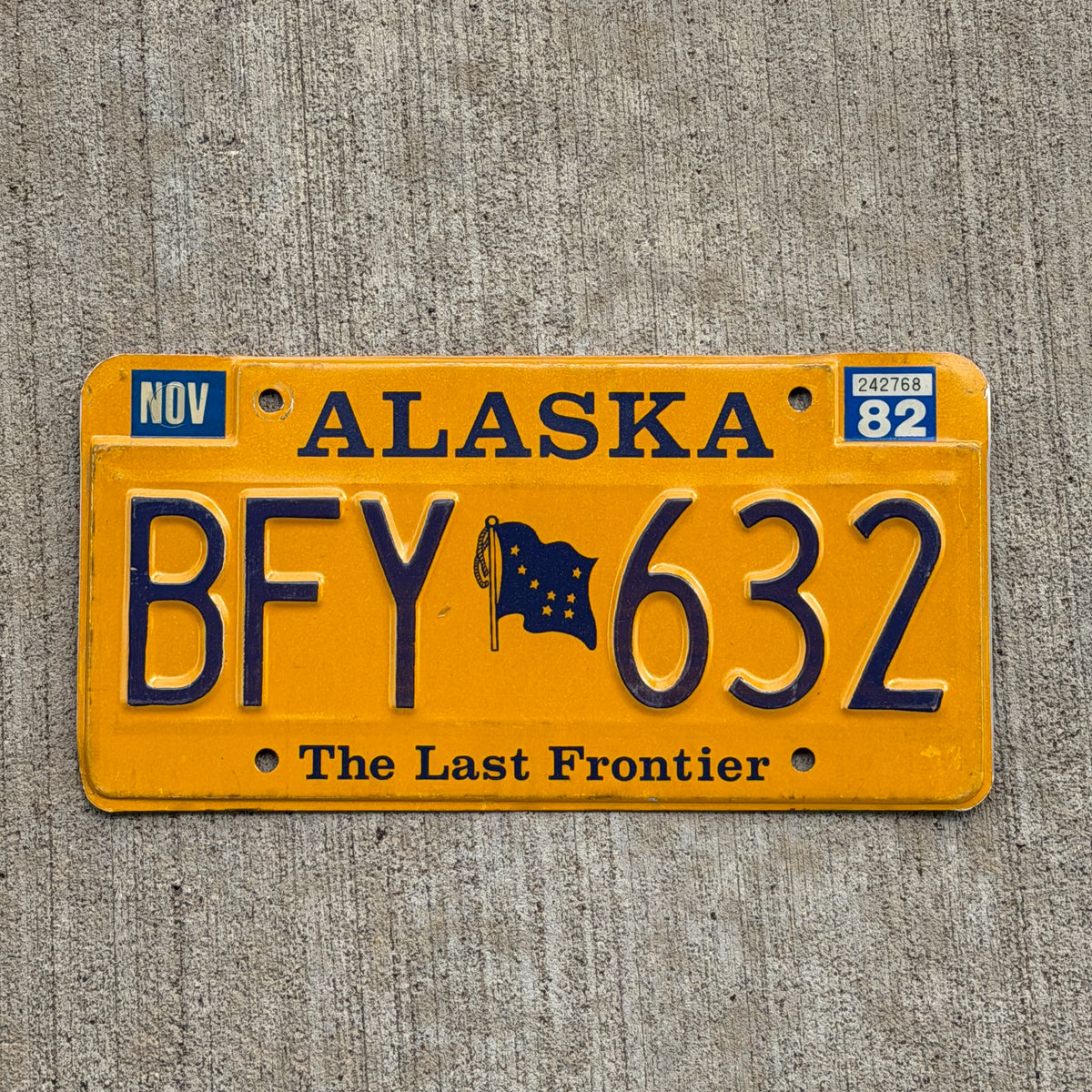 Photo of a 1982 Alaska License Plate Auto Tag Garage Decor Vintage Natural 1982 Sticker BFY 632 with original patina