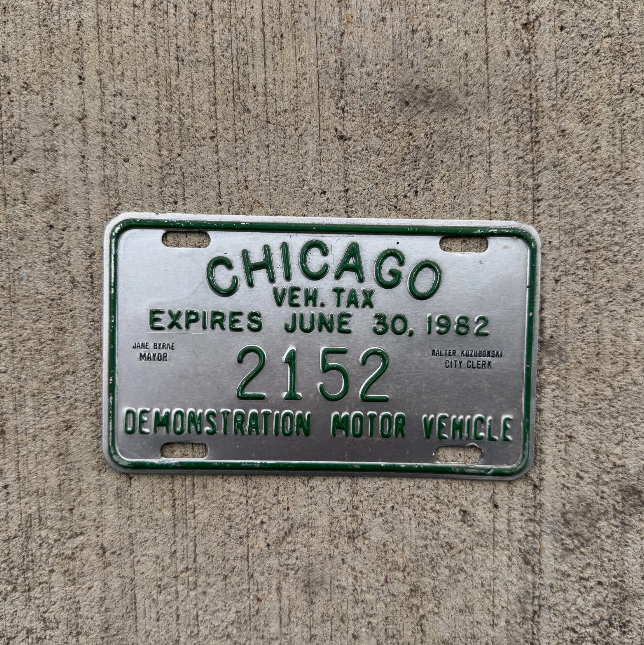 Photo of a 1982 Chicago Demonstration Motor Vehicle Dealer Tax Tag Auto Tag Garage Decor Vintage 2152