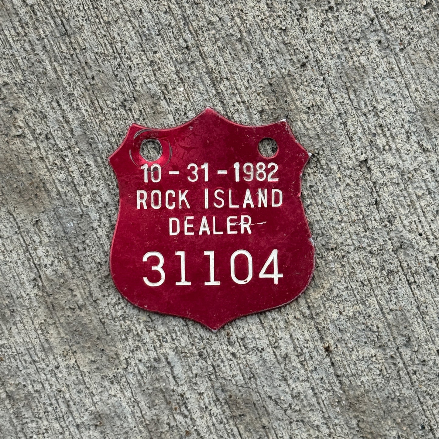 Photo of a 1982 Illinois Dealer Tax Tag License Plate Auto Tag Garage Decor Vintage Badge 31104 with original patina