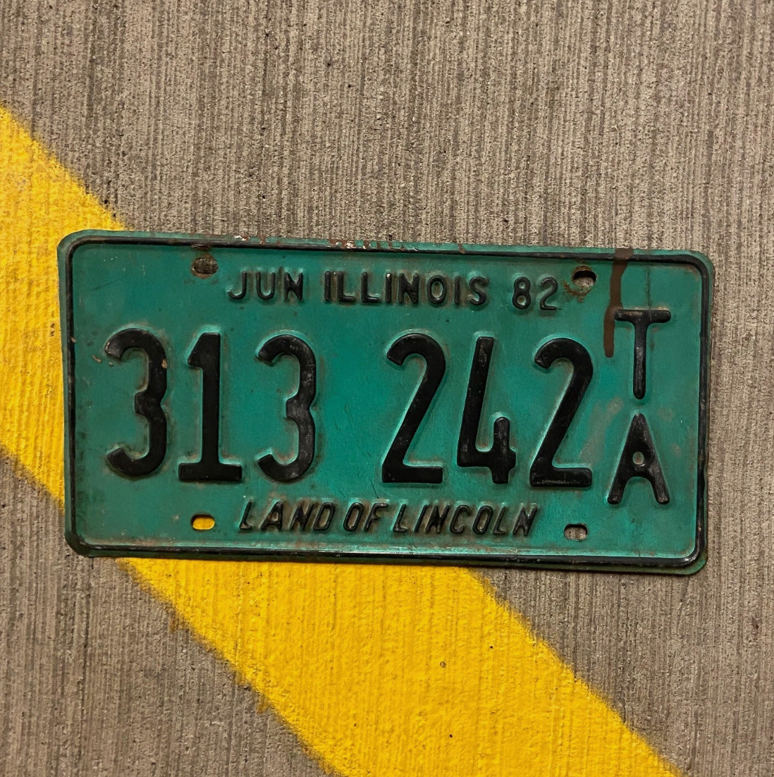 Photo of a 1982 Illinois Trailer License Plate Auto Tag Garage Decor Vintage 313 242 TA