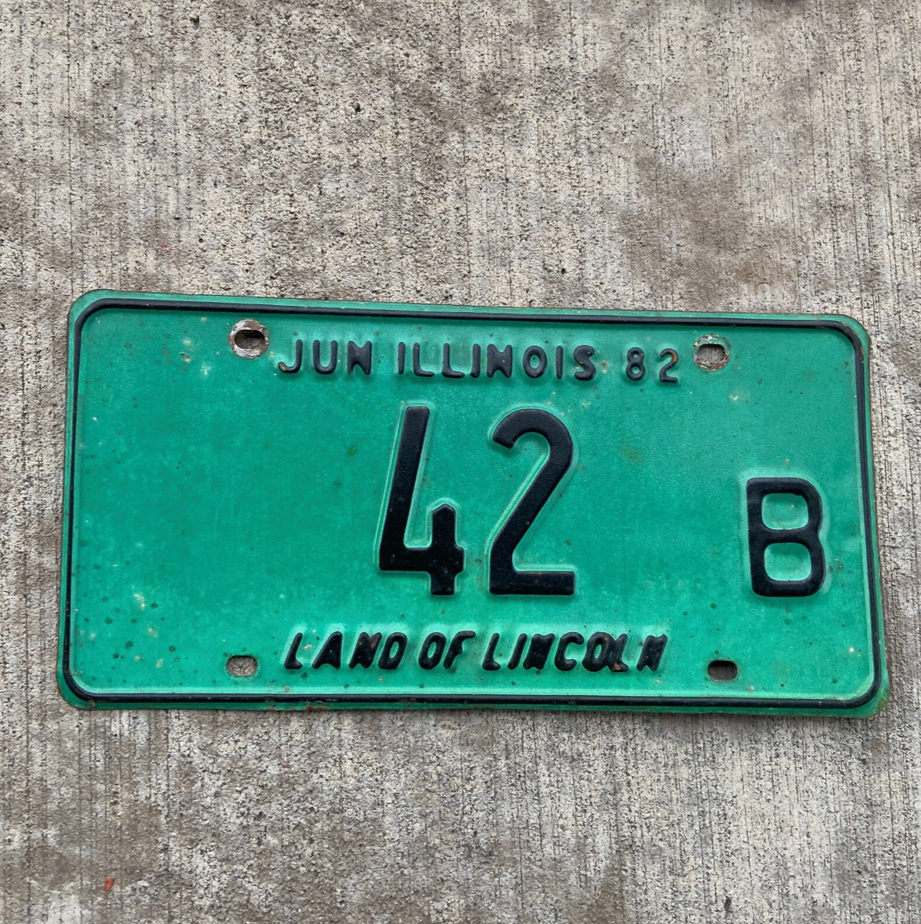 Photo of a 1982 Illinois Truck License Plate Auto Tag Garage Decor Vintage Low Number Two Digit 42 B with original patina