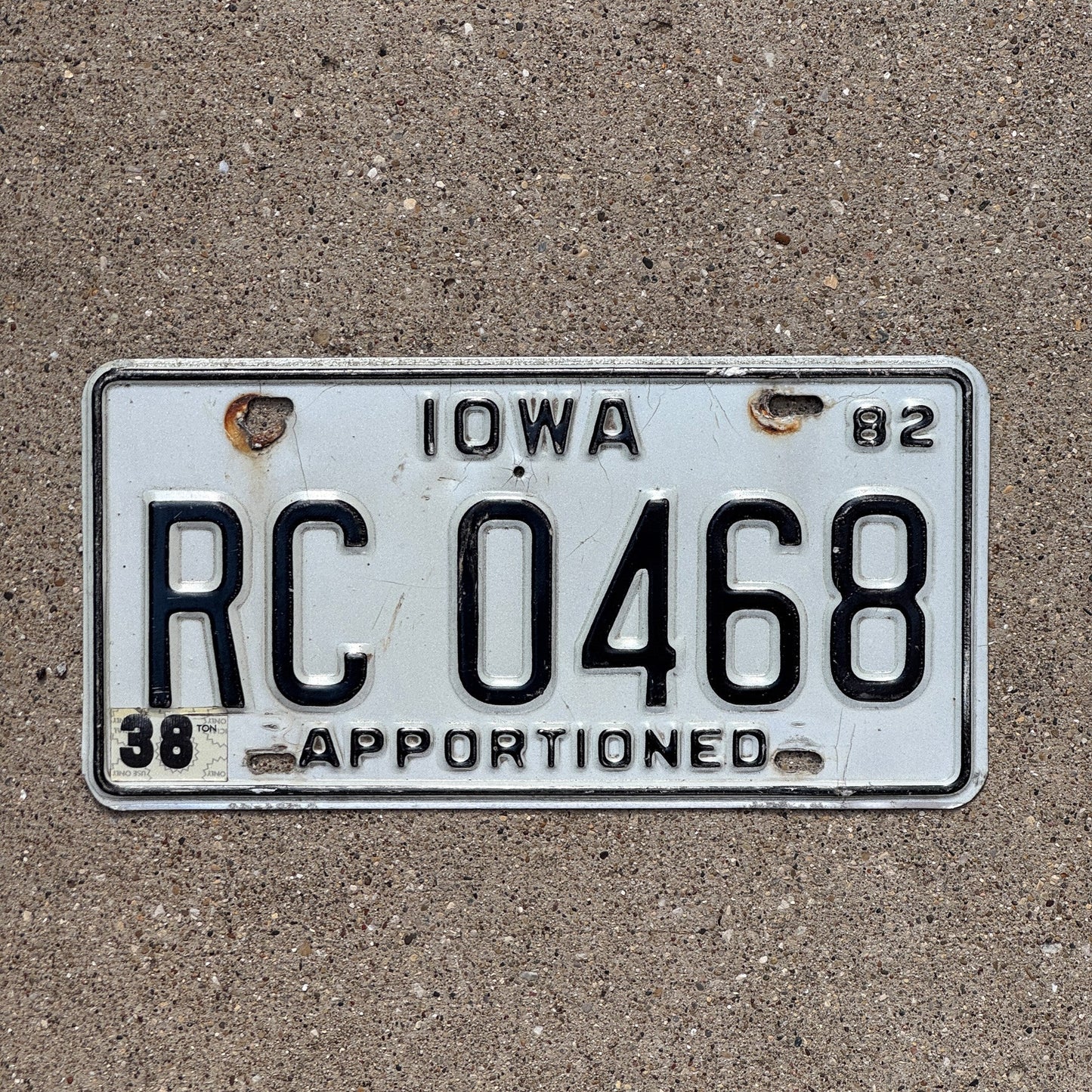 Photo of a 1982 Iowa Apportioned License Plate Auto Tag Garage Decor Vintage RC 0468