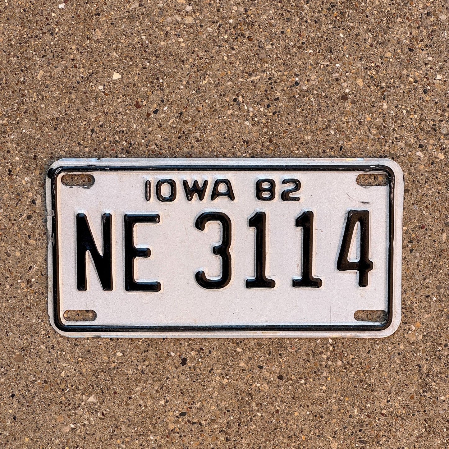 Photo of a 1982 Iowa Motorcycle License Plate Auto Tag Garage Decor Vintage NE 3114