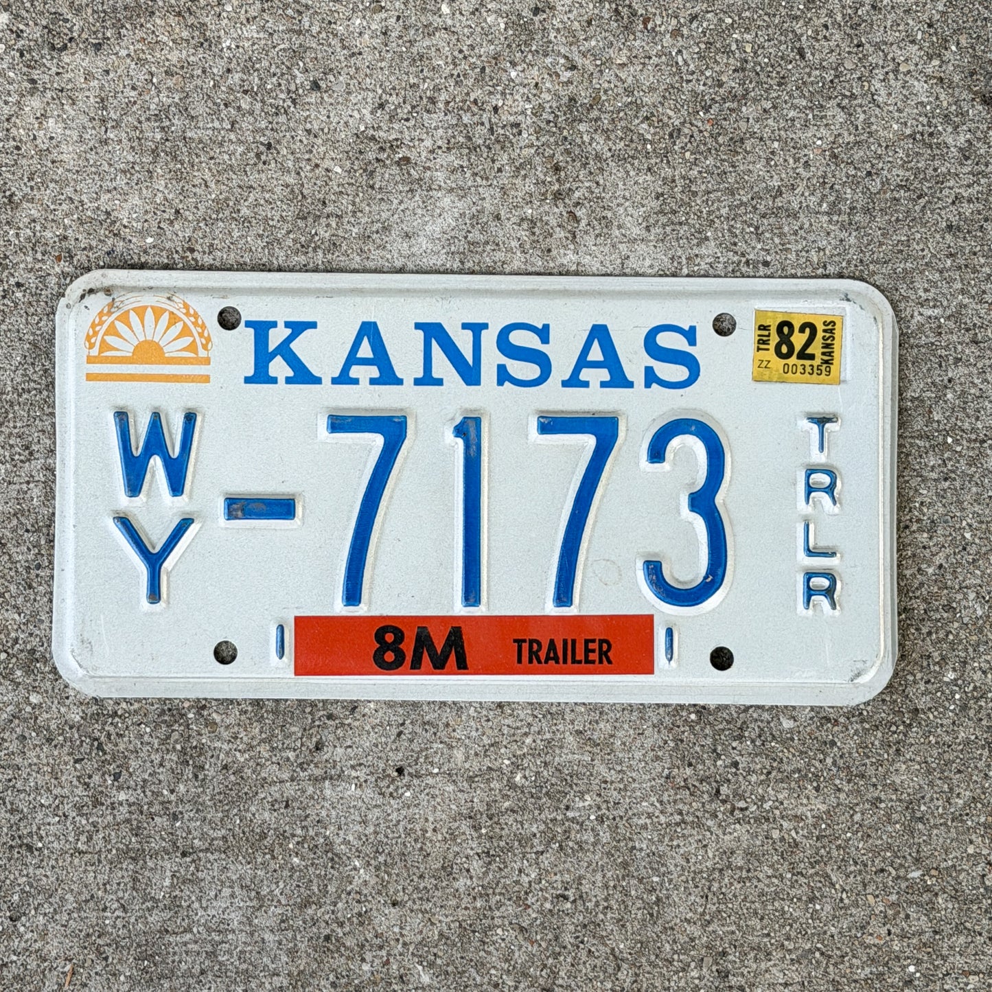 Photo of a 1982 Kansas Trailer License Plate Auto Tag Garage Decor Vintage WY 7173 with original patina