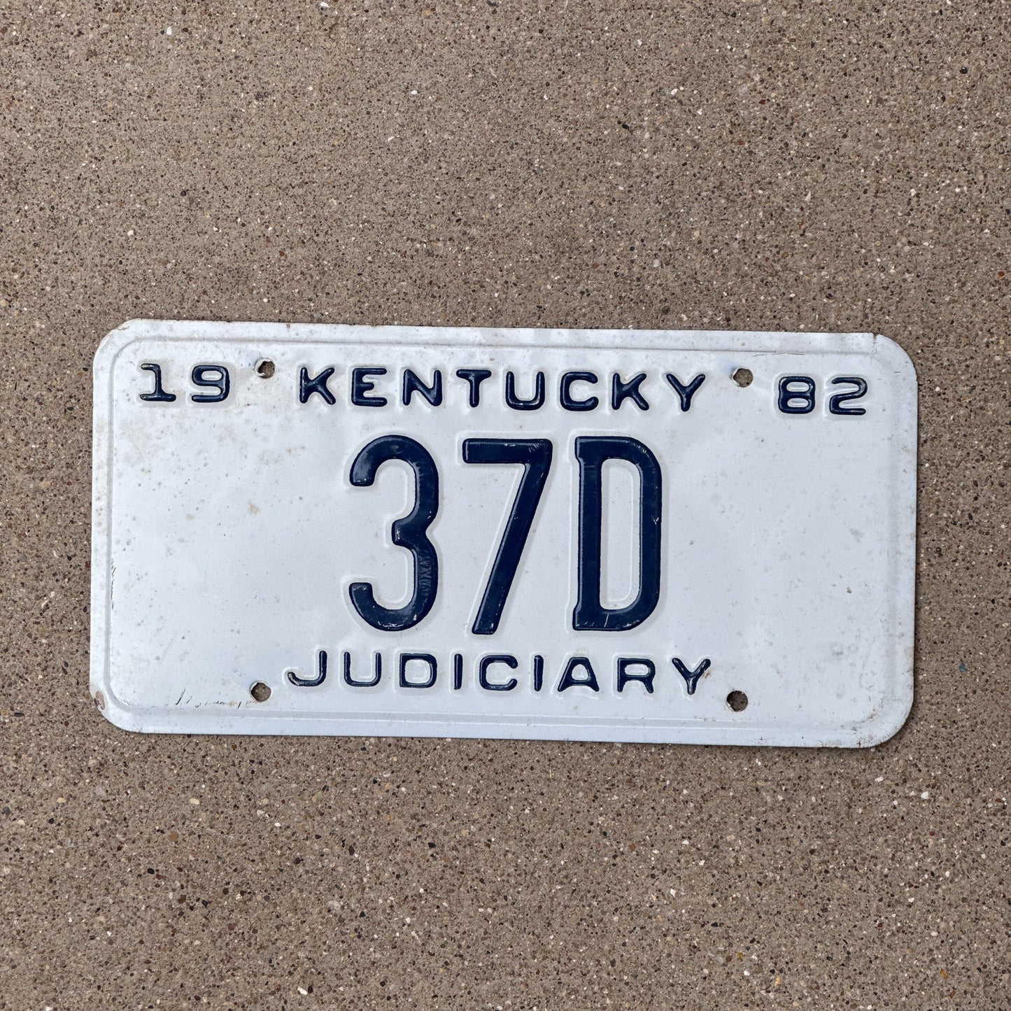Photo of a 1982 Kentucky Judiciary License Plate Auto Tag Garage Decor Vintage Judge Court Law 37 D