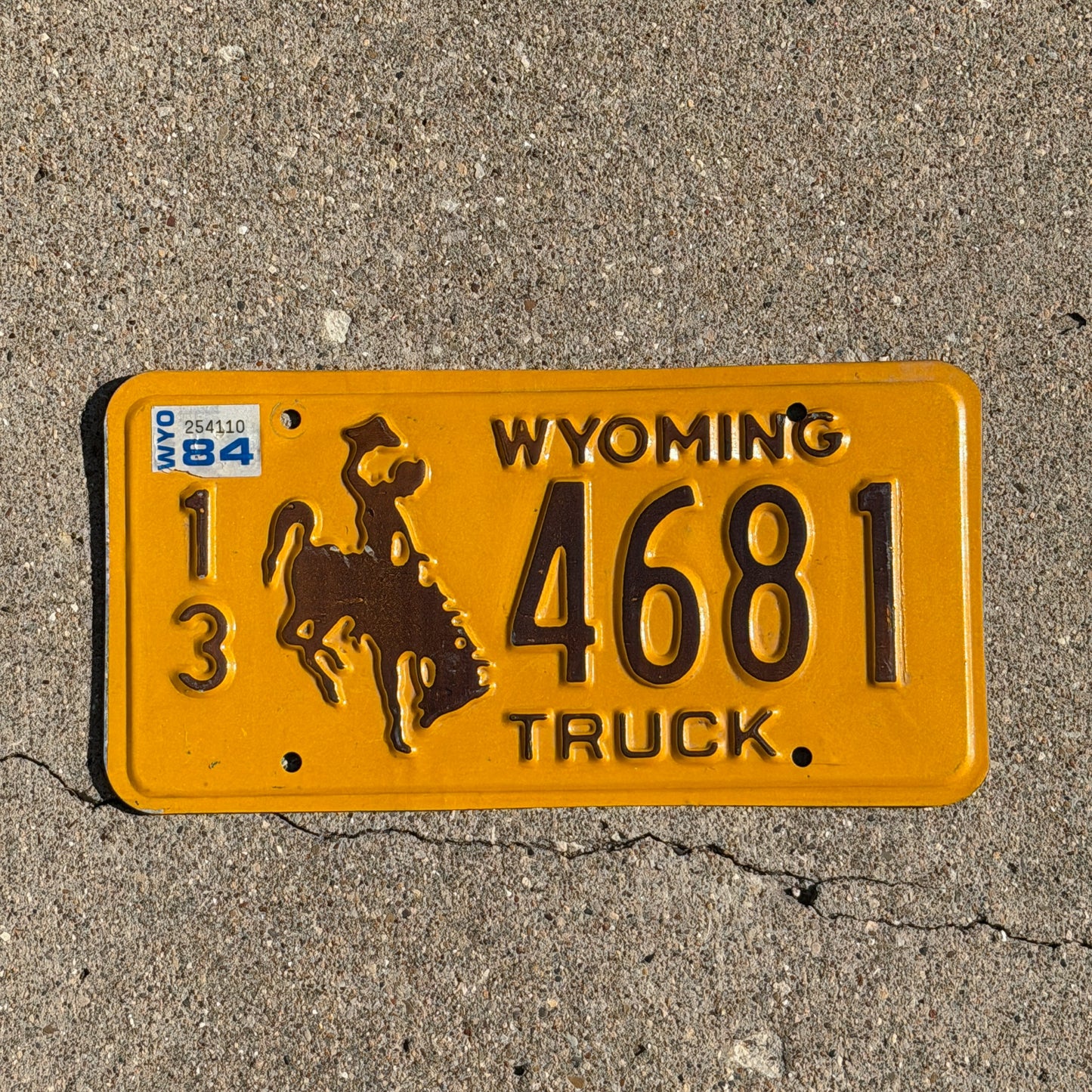 Photo of a 1983 1984 Wyoming Truck License Plate Auto Tag Garage Decor Vintage Cowboy Rodeo 13 4681 with original patina