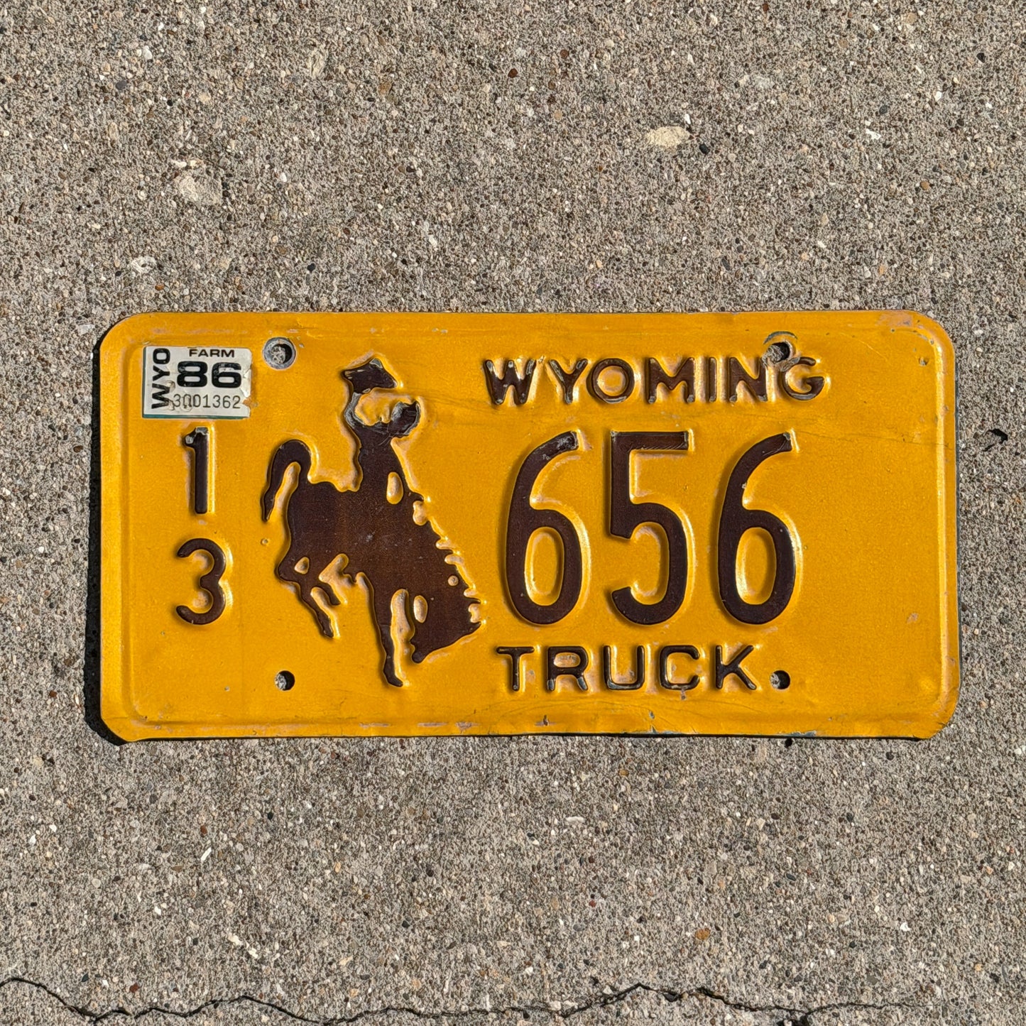 Photo of a 1983 1986 Wyoming Truck License Plate Auto Tag 1 Vintage Cowboy Rodeo 13 656 with original patina