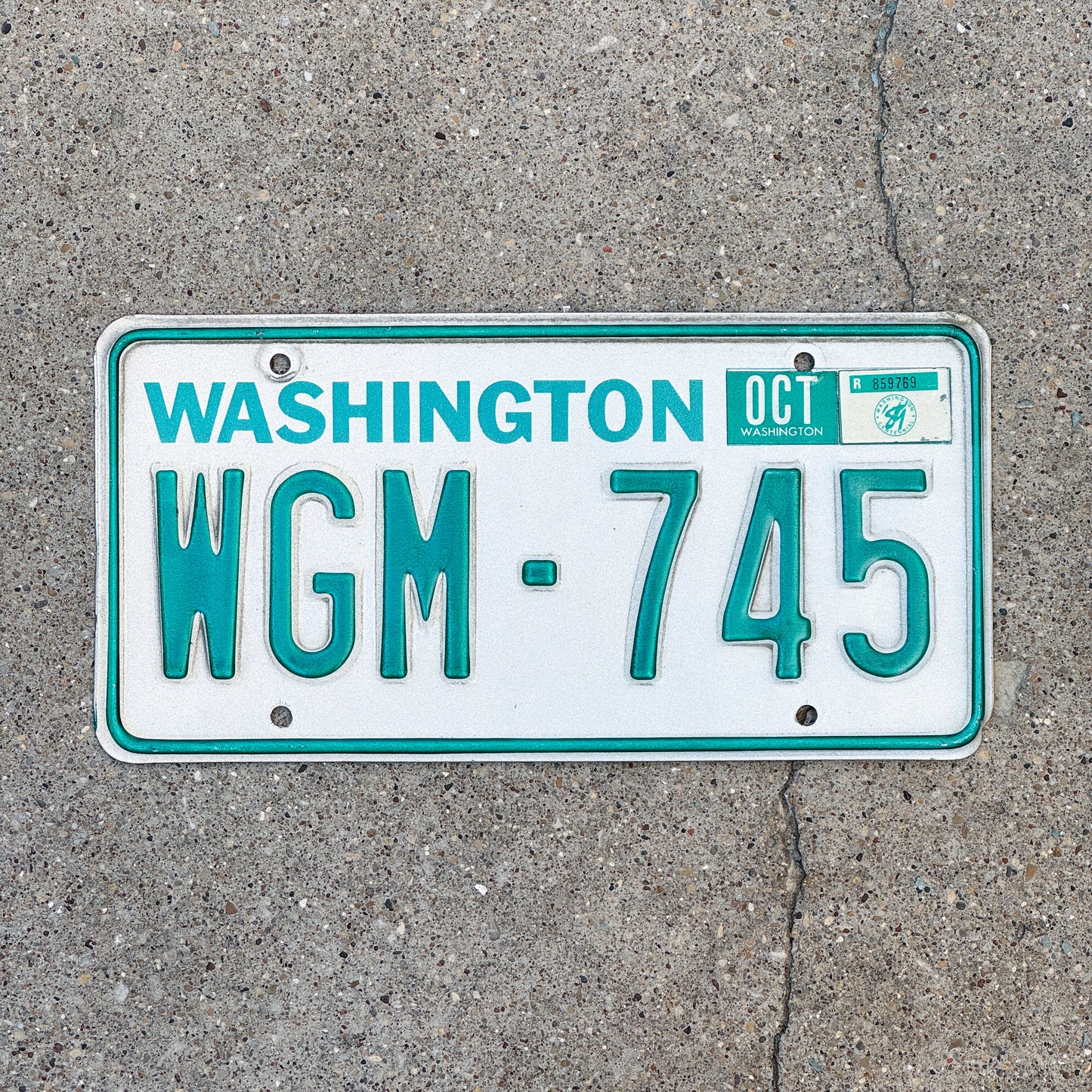 Photo of a 1983 1989 Washington License Plate Auto Tag Garage Decor Vintage DMV Clear Number WGM 745 with original patina