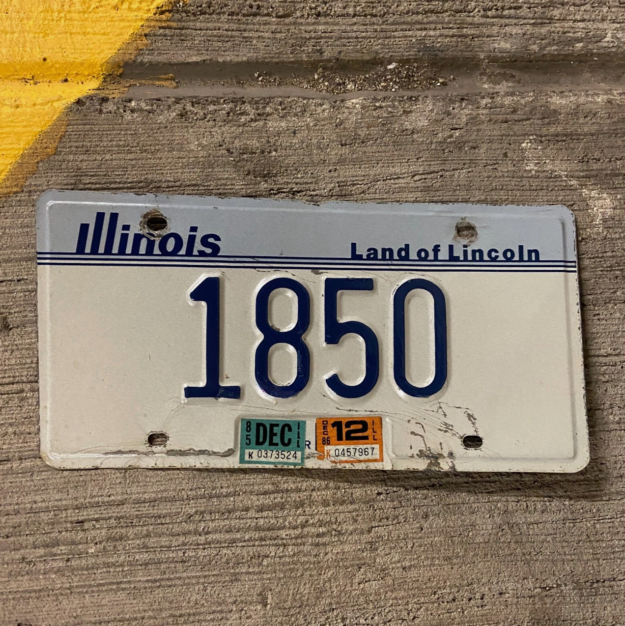 Photo of a 1983 86 Illinois License Plate Auto Tag Garage Decor Vintage Low Number Four Digit 1850 with original patina